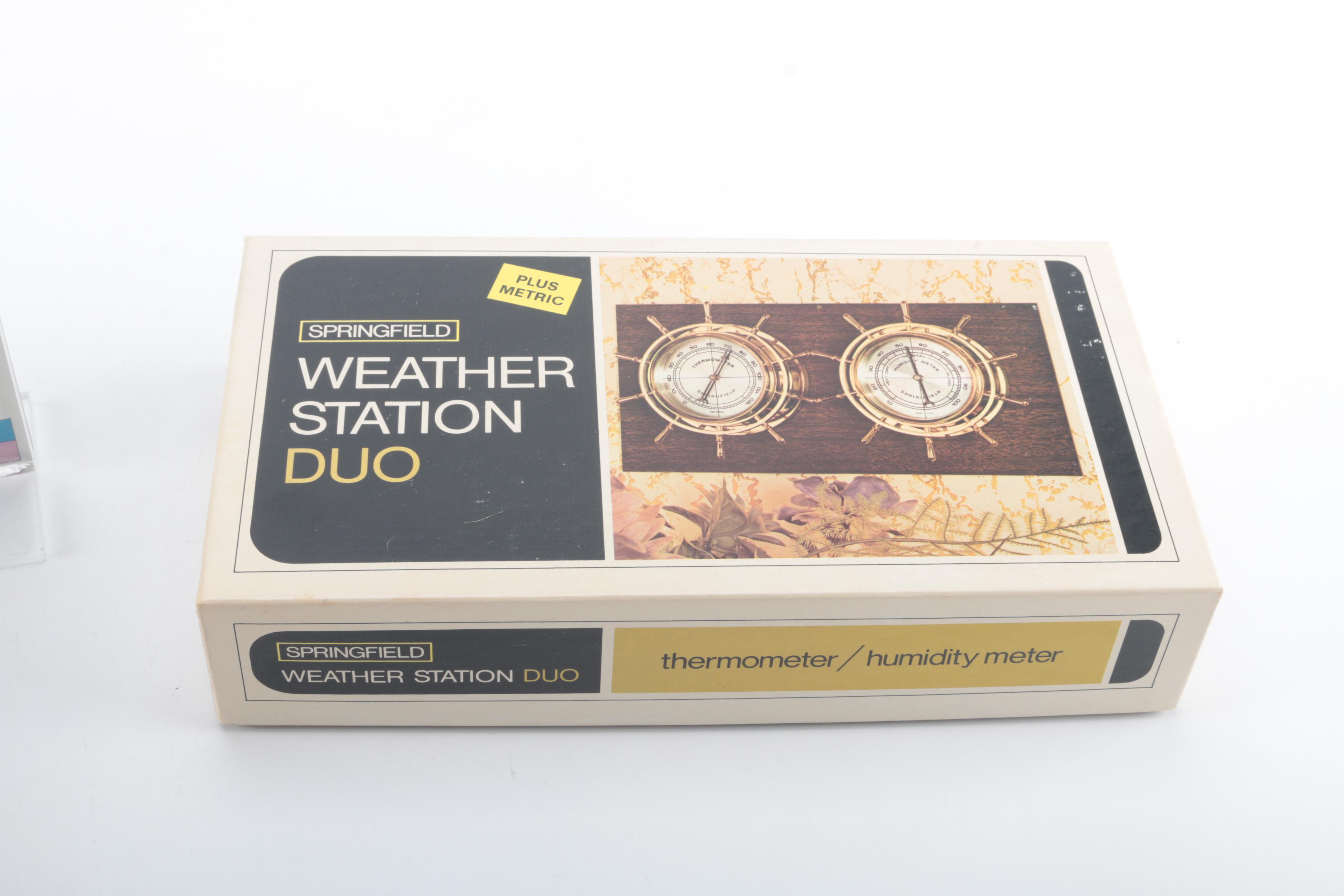 An Amazon Kindle, Weather Station, Car Compass and Clock Radio