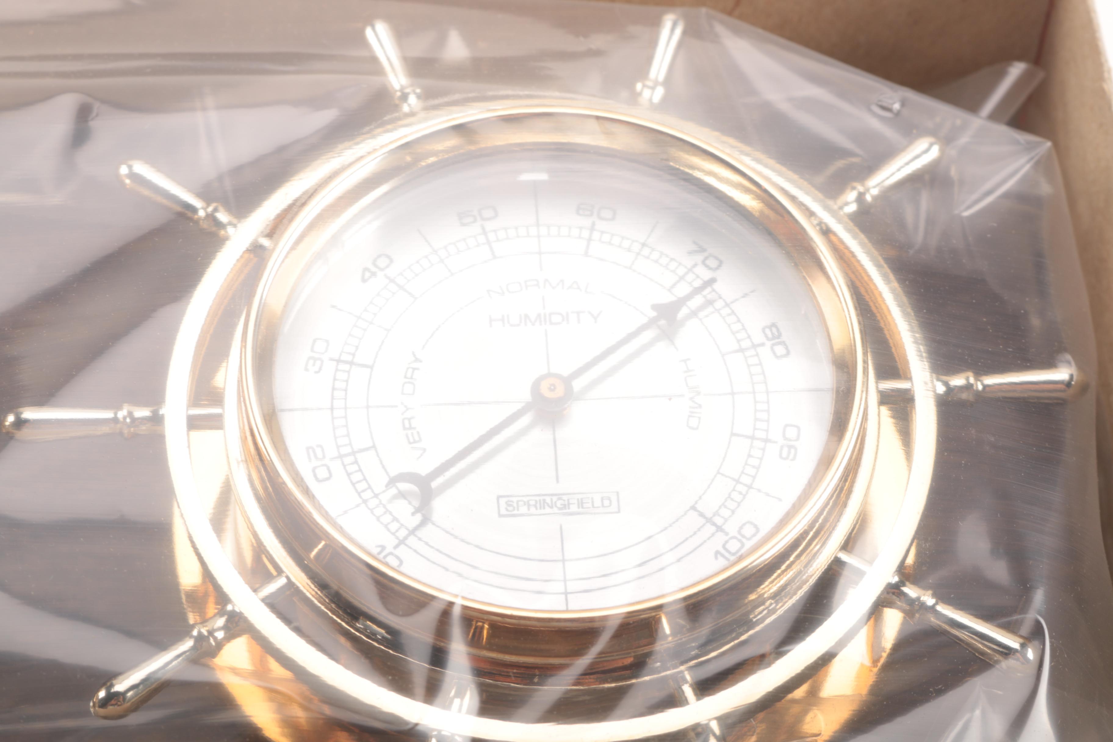 An Amazon Kindle, Weather Station, Car Compass and Clock Radio