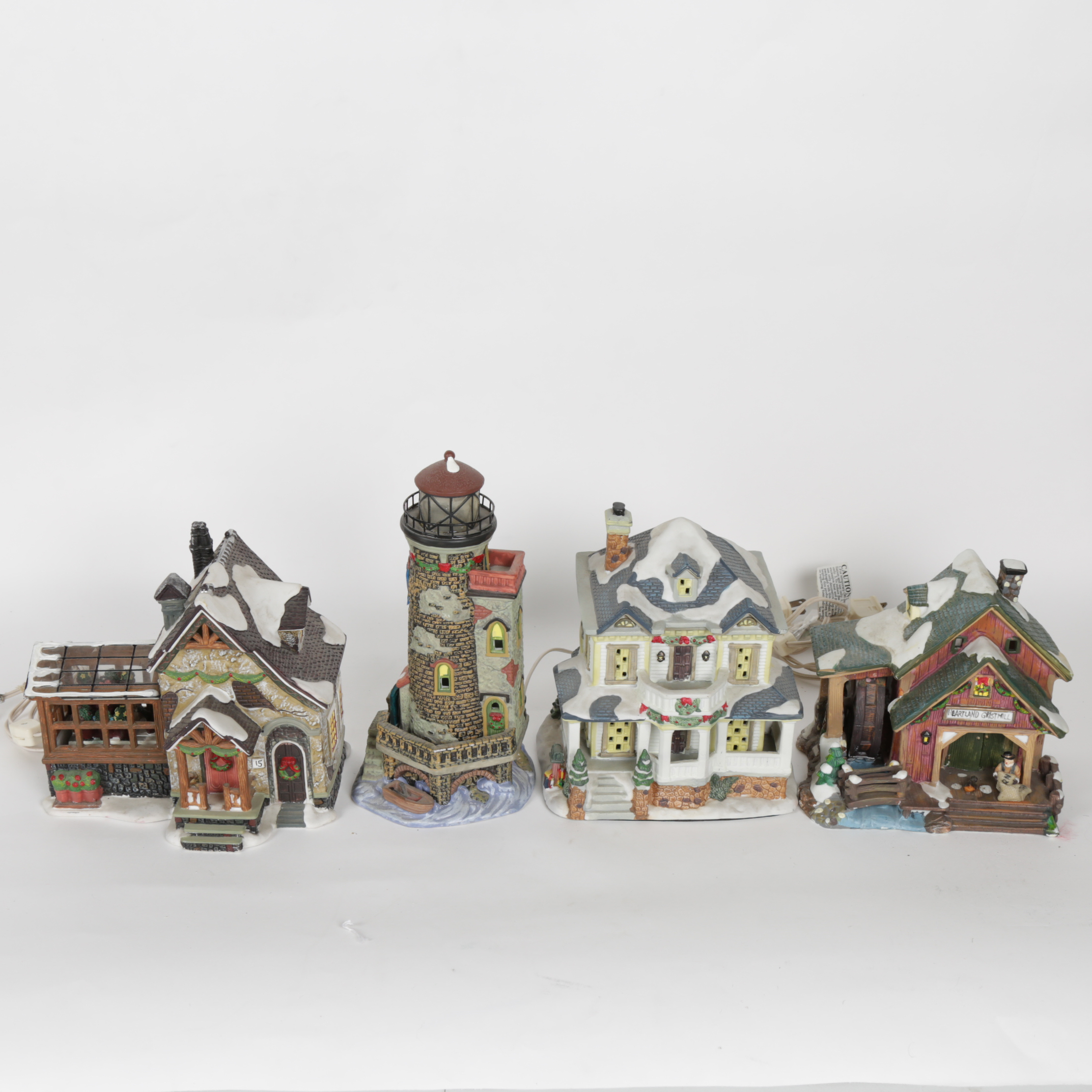 Collection of "Santa's Workbench Collection" Illuminated Houses