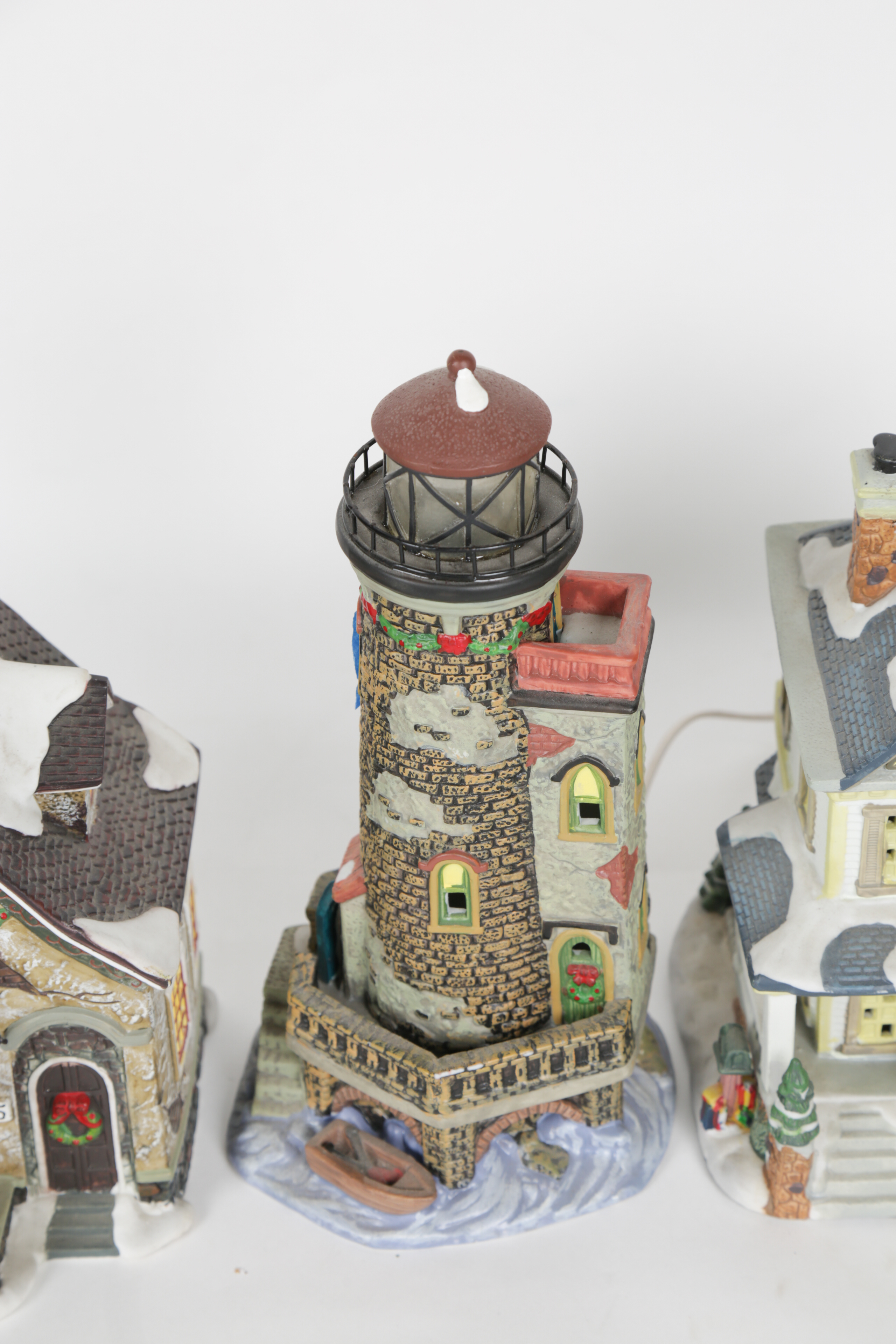 Collection of "Santa's Workbench Collection" Illuminated Houses