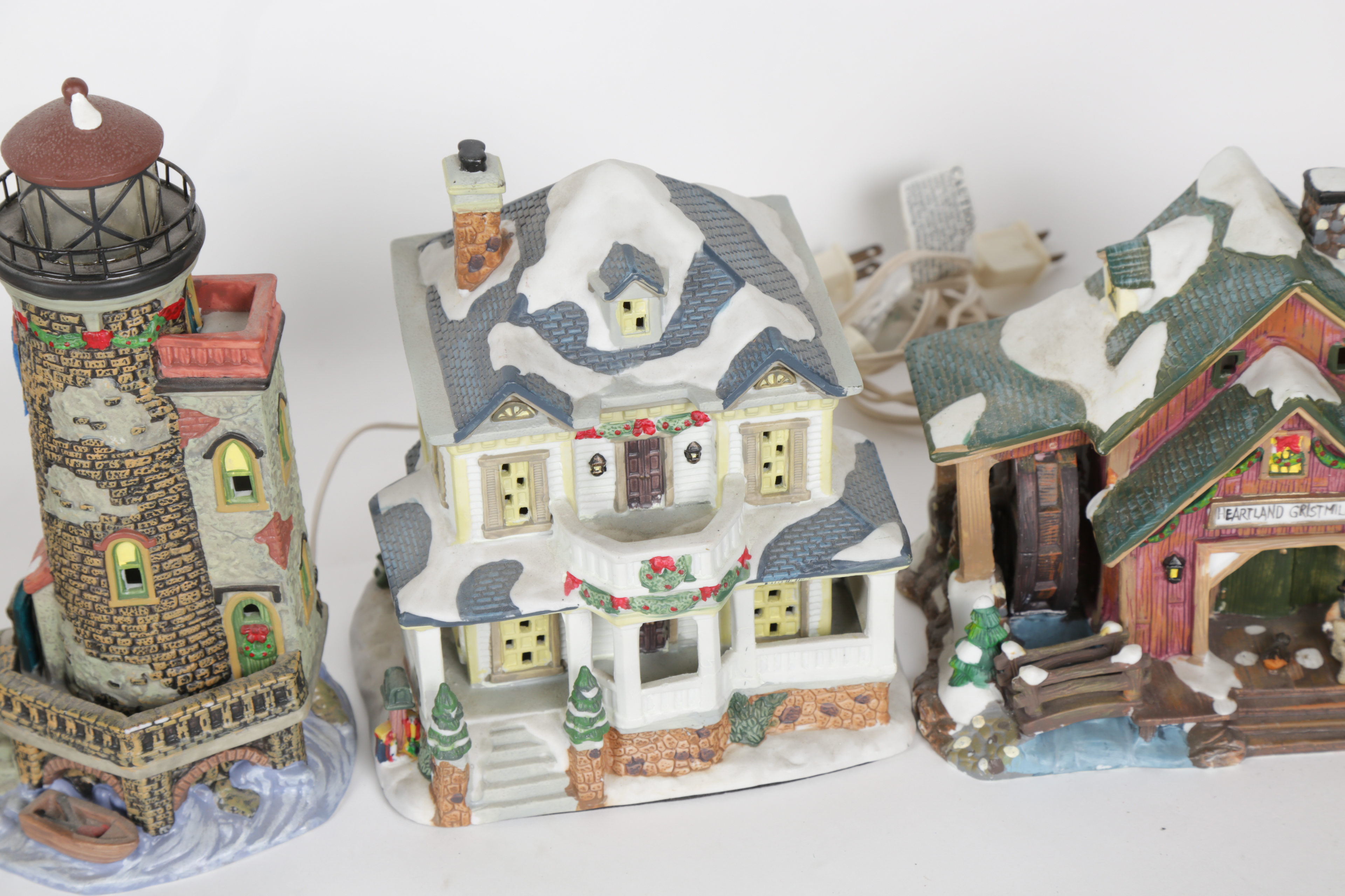 Collection of "Santa's Workbench Collection" Illuminated Houses