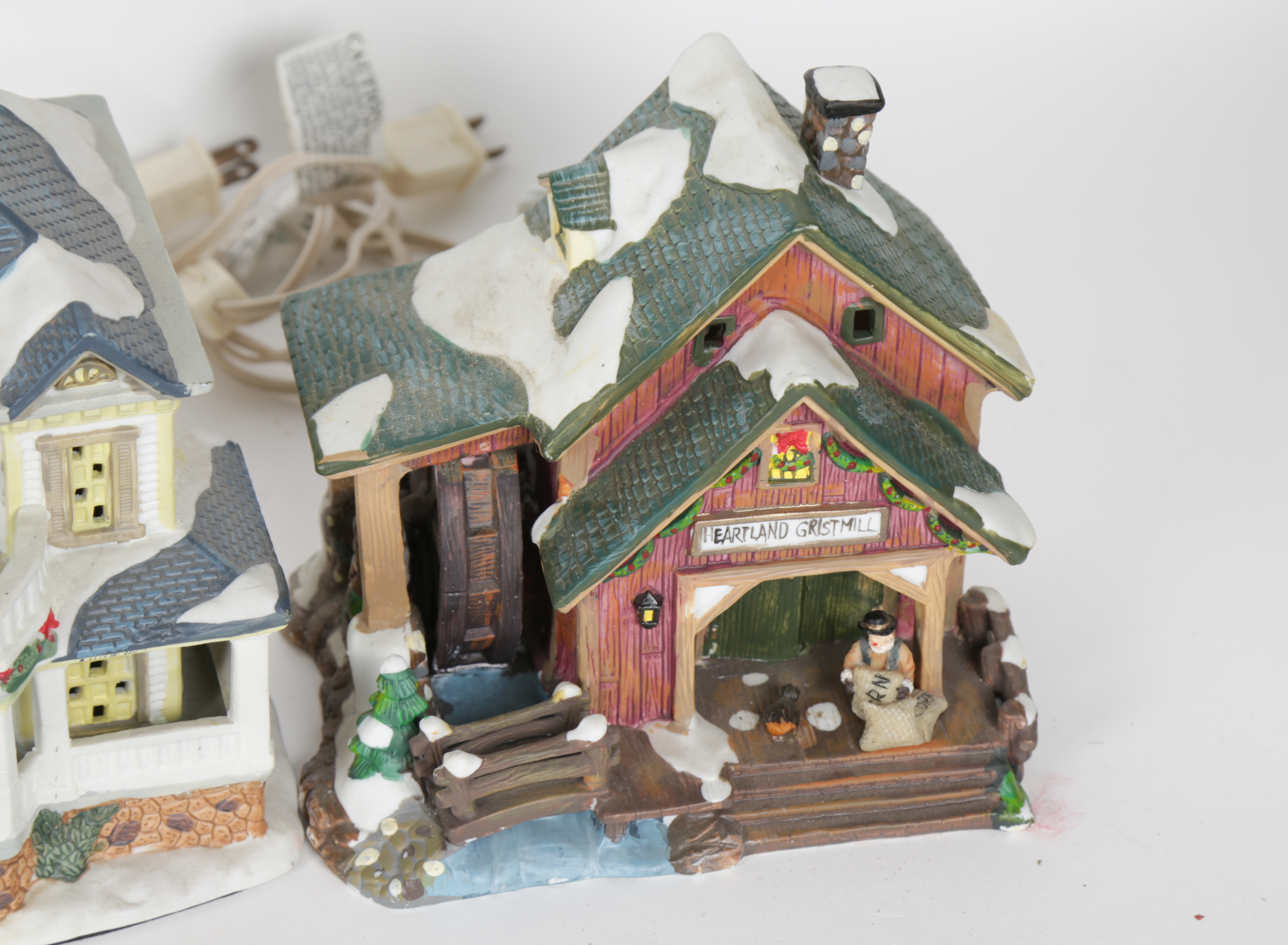 Collection of "Santa's Workbench Collection" Illuminated Houses