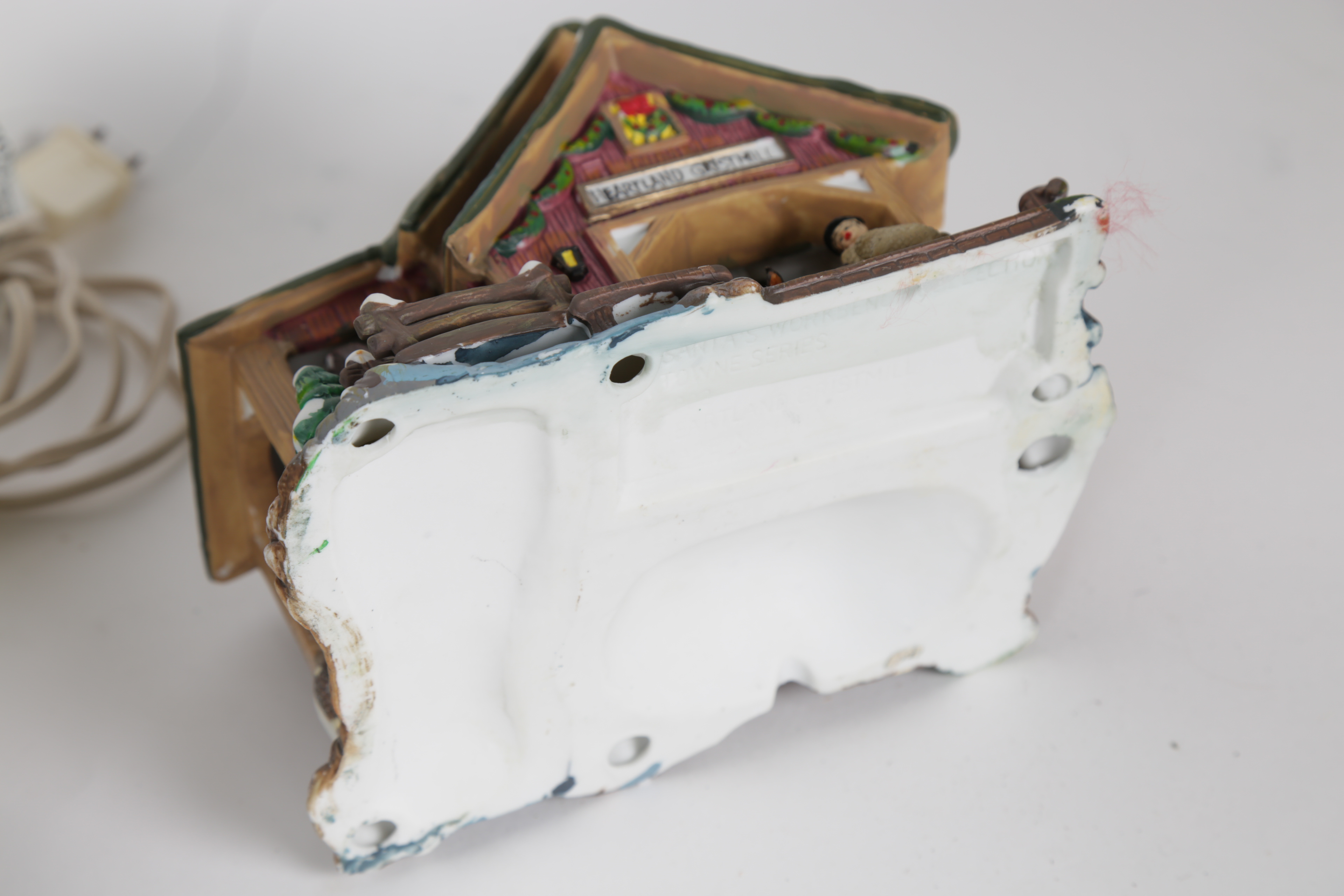 Collection of "Santa's Workbench Collection" Illuminated Houses