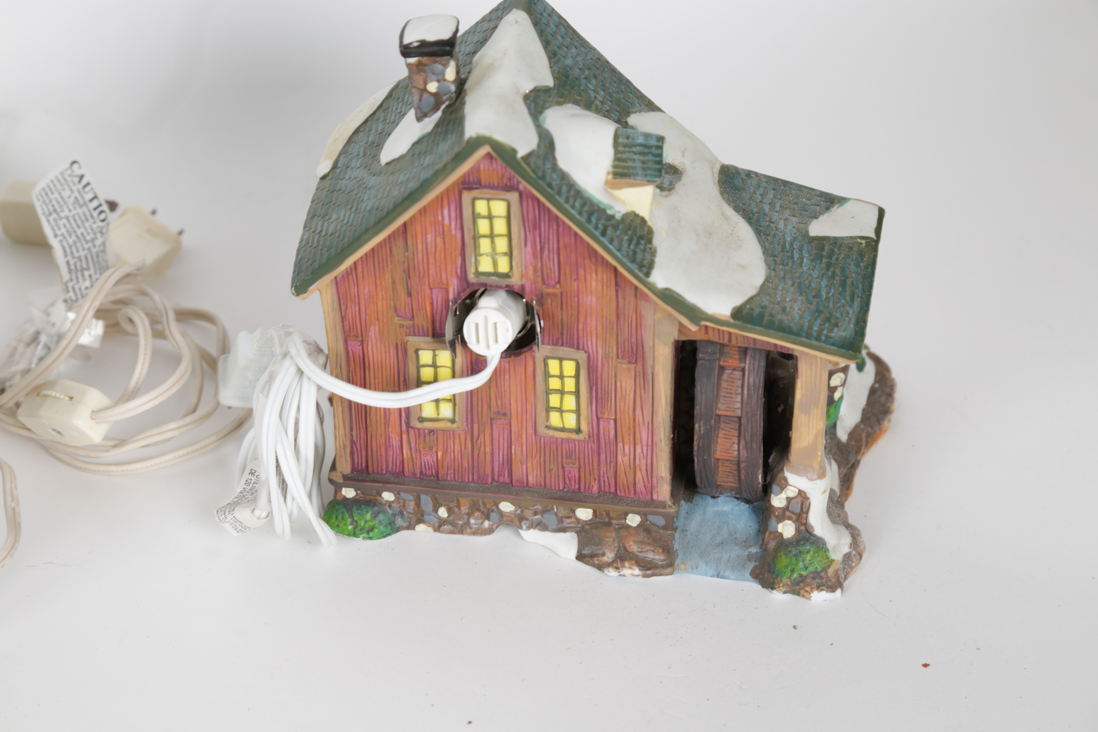 Collection of "Santa's Workbench Collection" Illuminated Houses