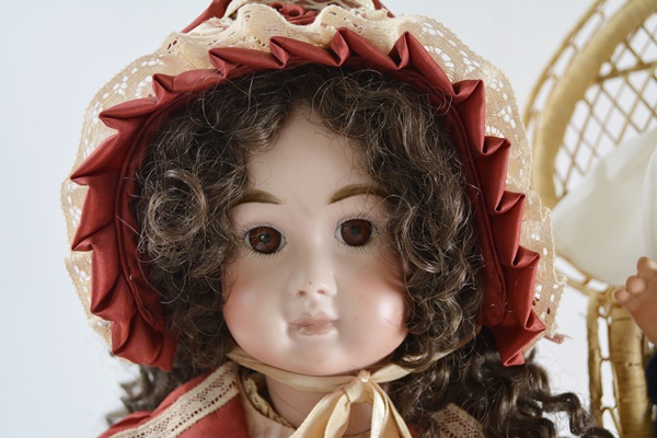Vintage Jules N. Steiner "Kahlie" Hand Painted Reproduction Doll and a Porcelain Doll