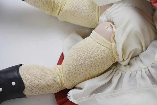 Vintage Jules N. Steiner "Kahlie" Hand Painted Reproduction Doll and a Porcelain Doll