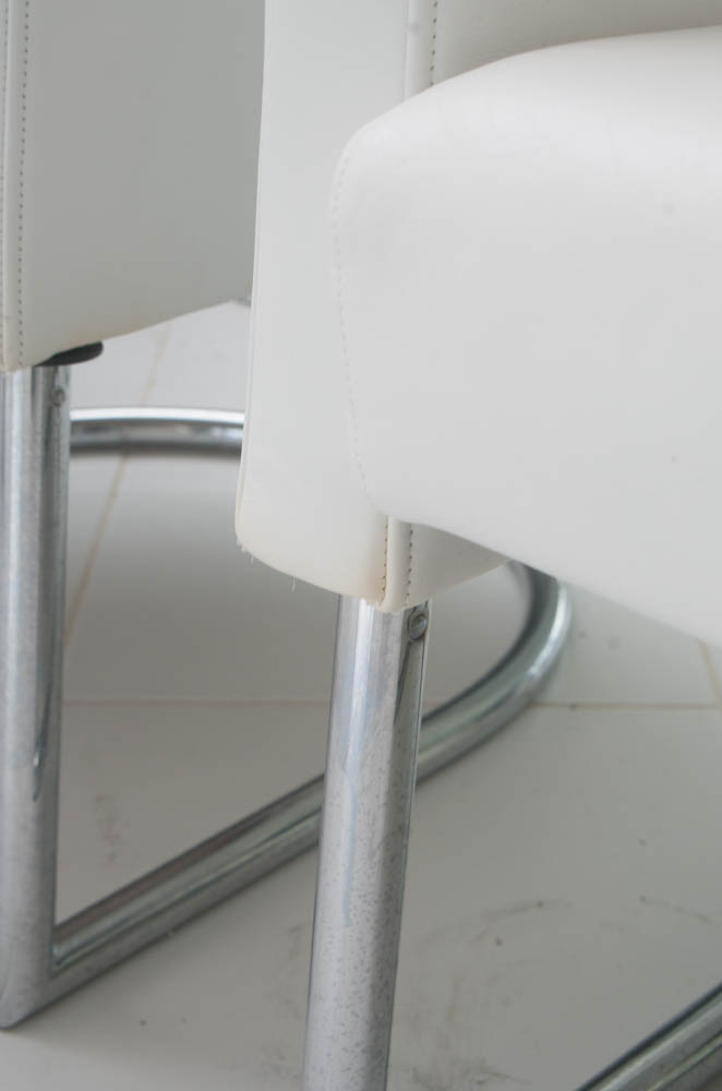 Two Modern White Leather Armchairs with Silver Toned Frames