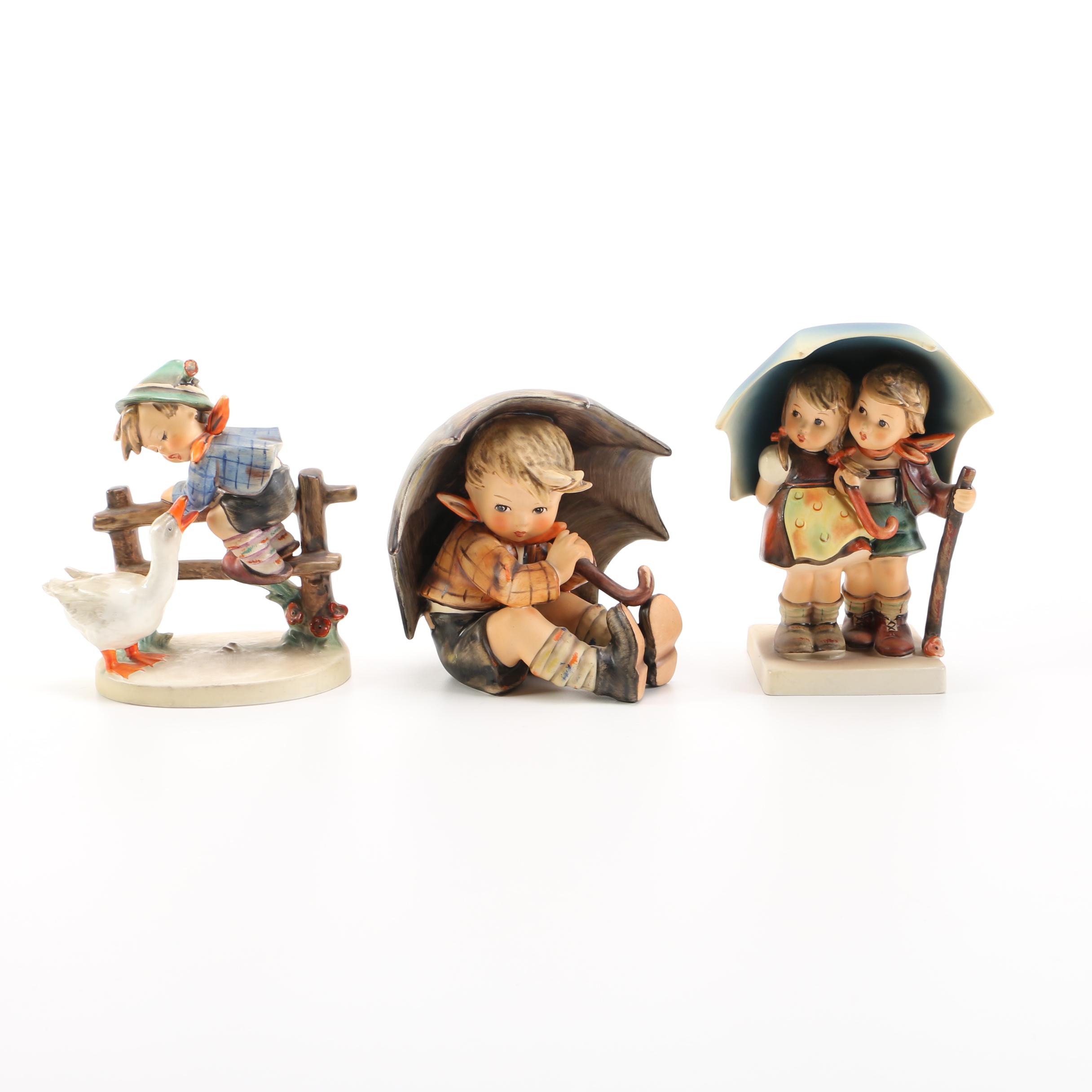 Goebel Hummel "Barnyard Hero", "Umbrella Boy" and "Stormy Weather" Porcelain Figurines