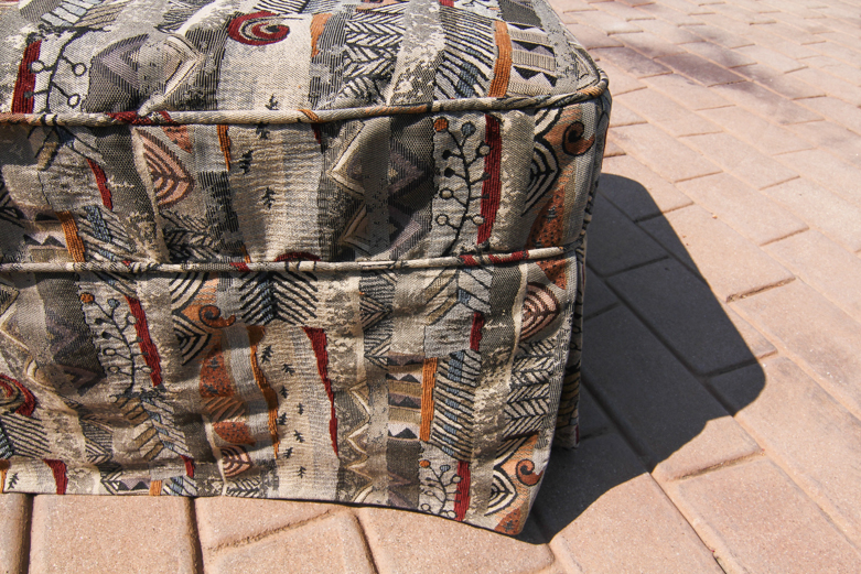 Ottoman With Abstract-Patterned Slipcover