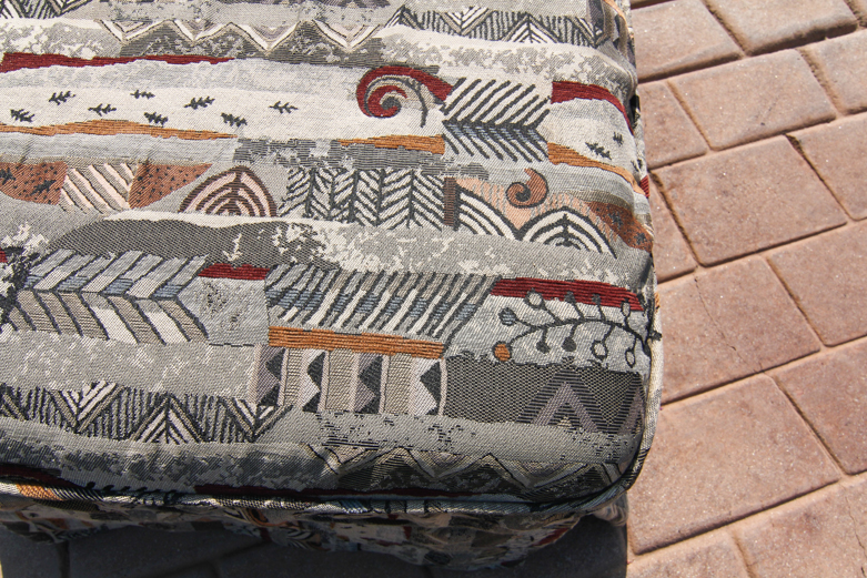 Ottoman With Abstract-Patterned Slipcover