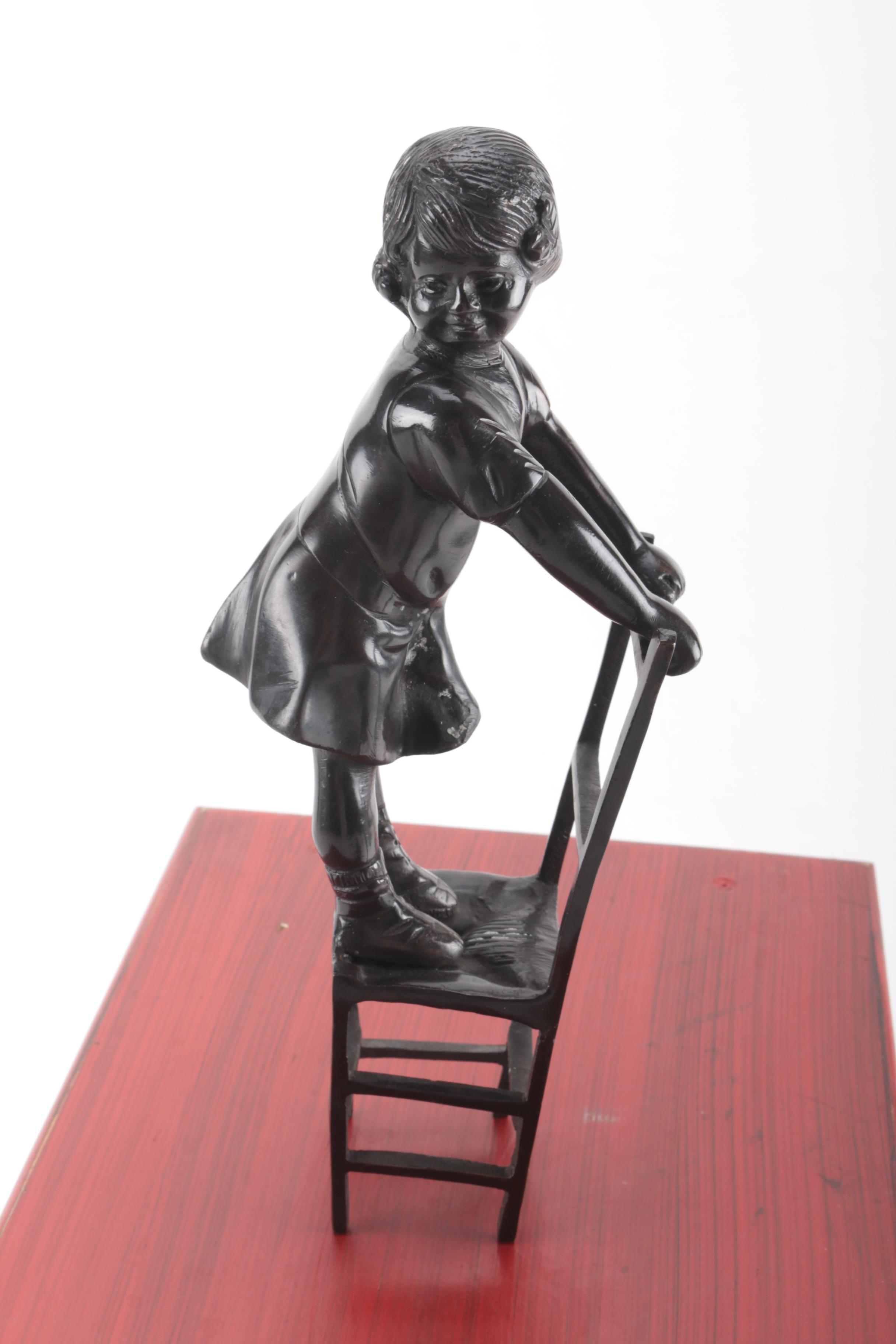 Ceramic Figurine and Wooden Stool