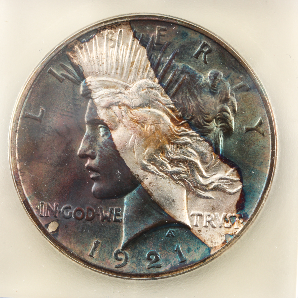 Encapsulated 1921 Peace Silver Dollar with Rainbow Toning