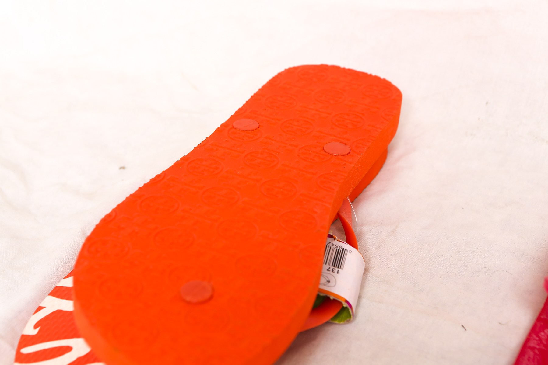 Two Pairs of Tory Burch Women's Flip Flops