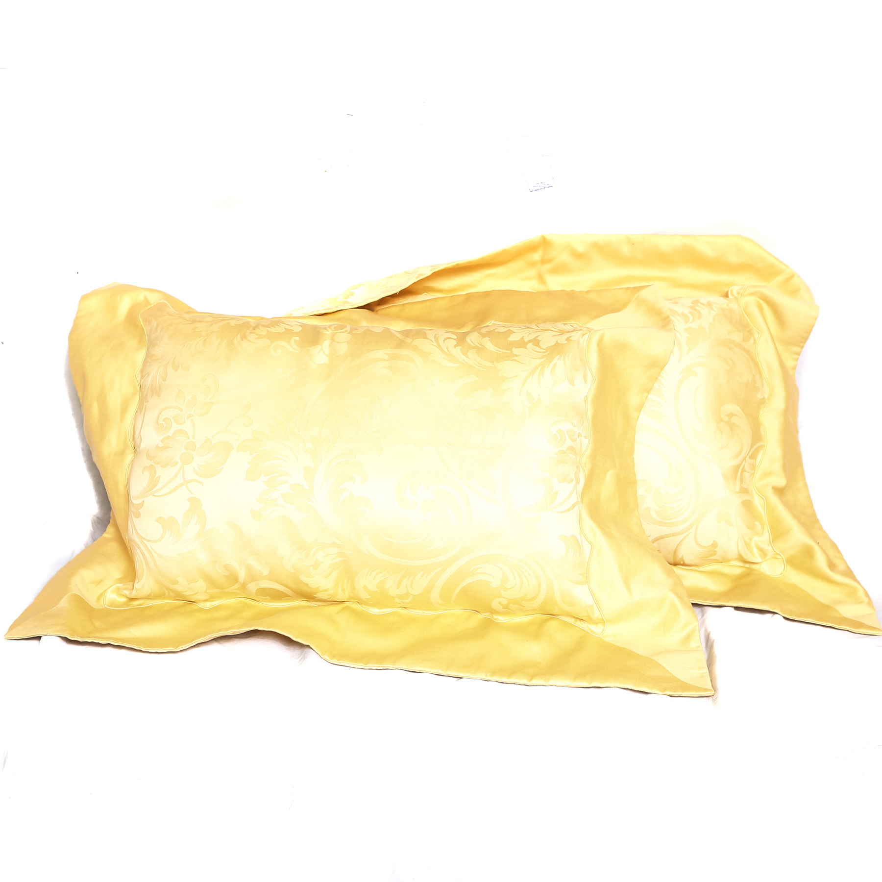 Two Pale Yellow Frette Throw Pillows