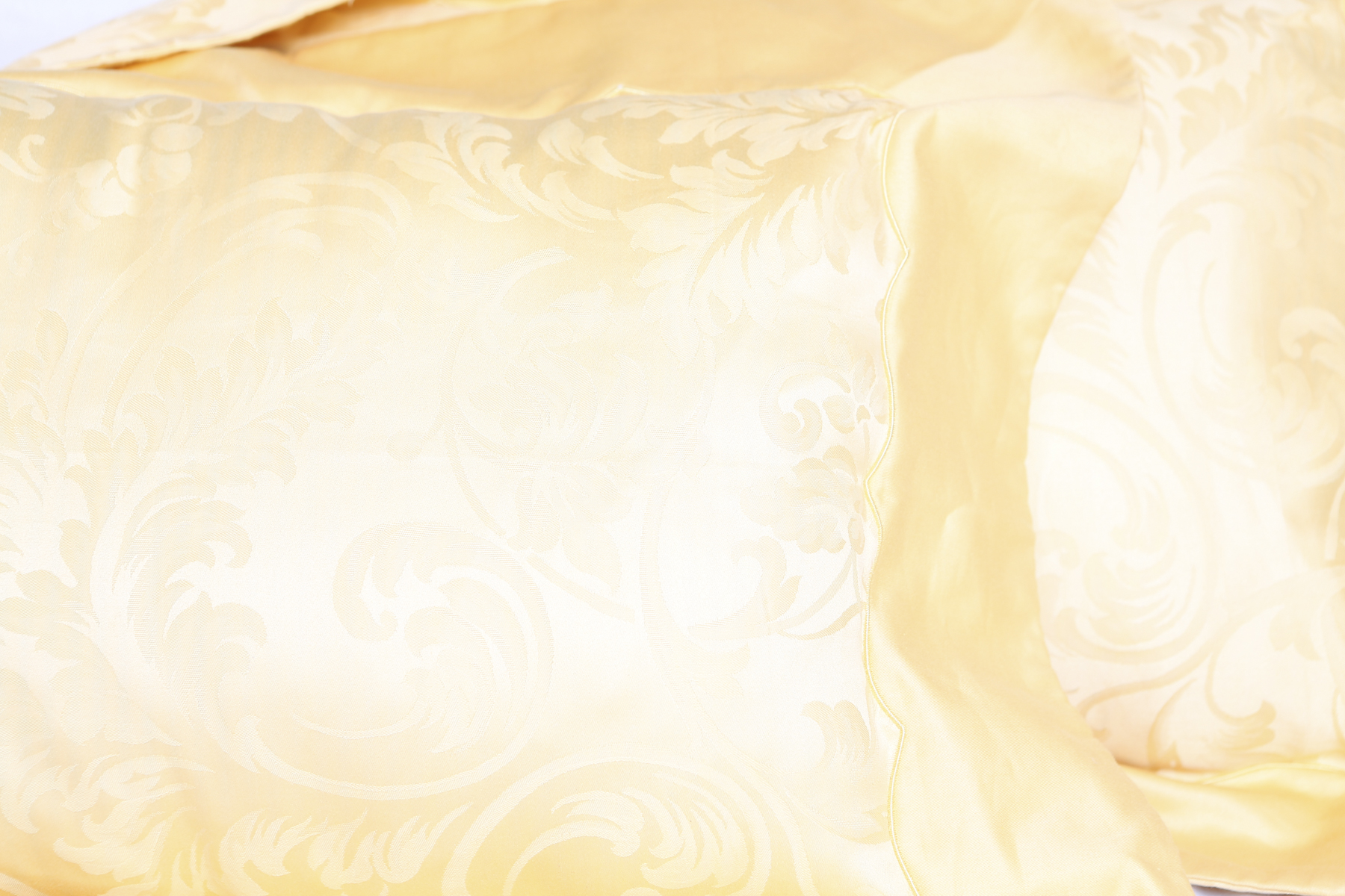 Two Pale Yellow Frette Throw Pillows