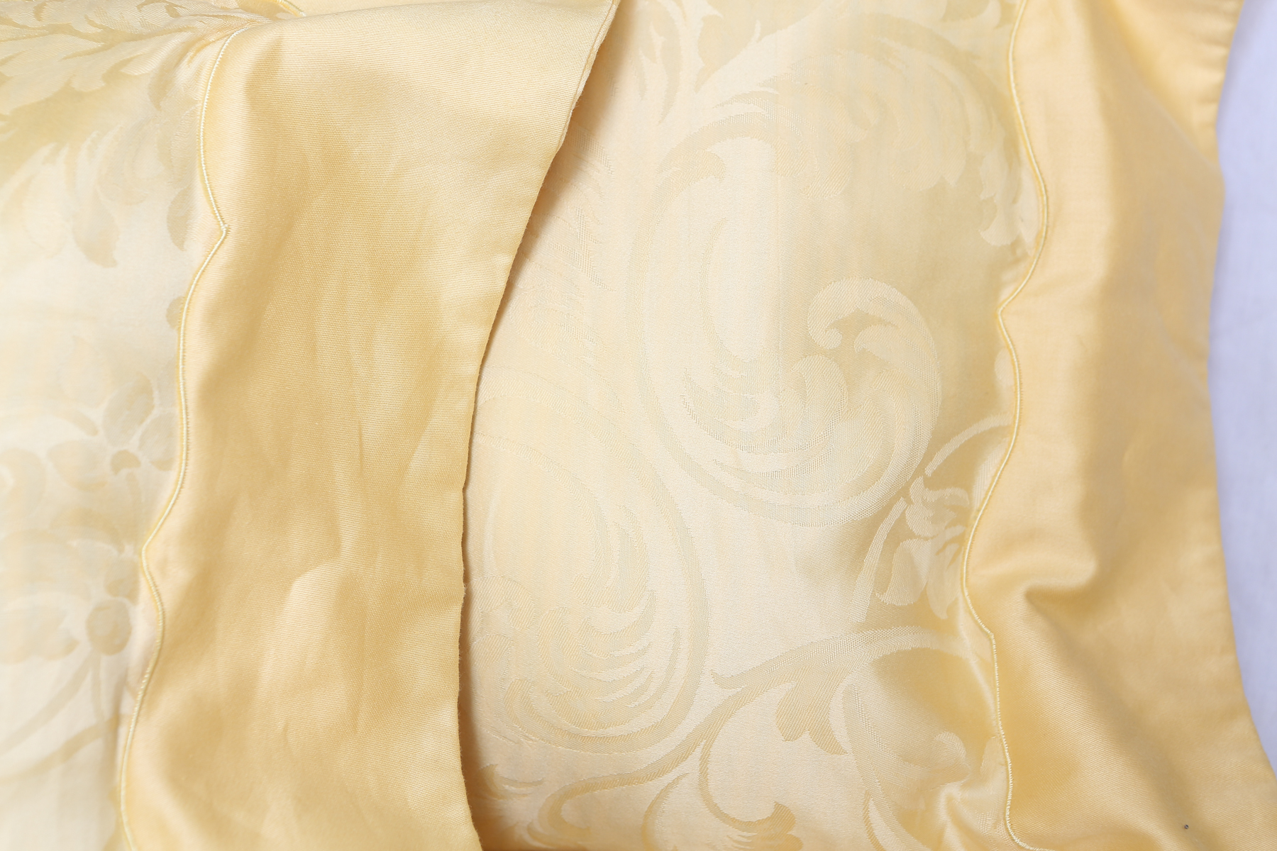 Two Pale Yellow Frette Throw Pillows