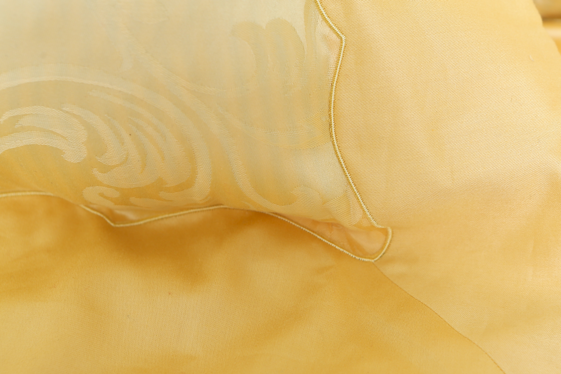 Two Pale Yellow Frette Throw Pillows