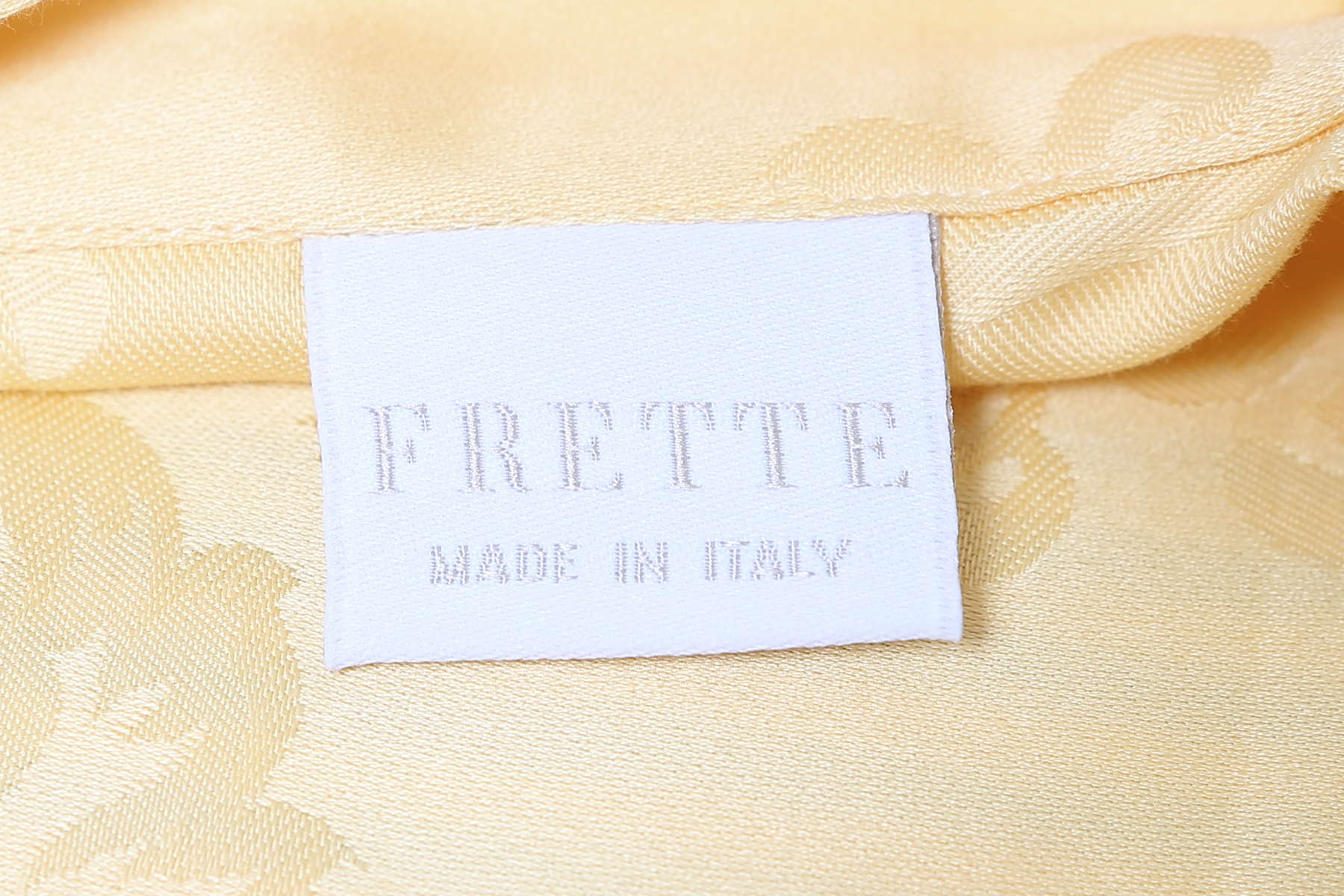Two Pale Yellow Frette Throw Pillows