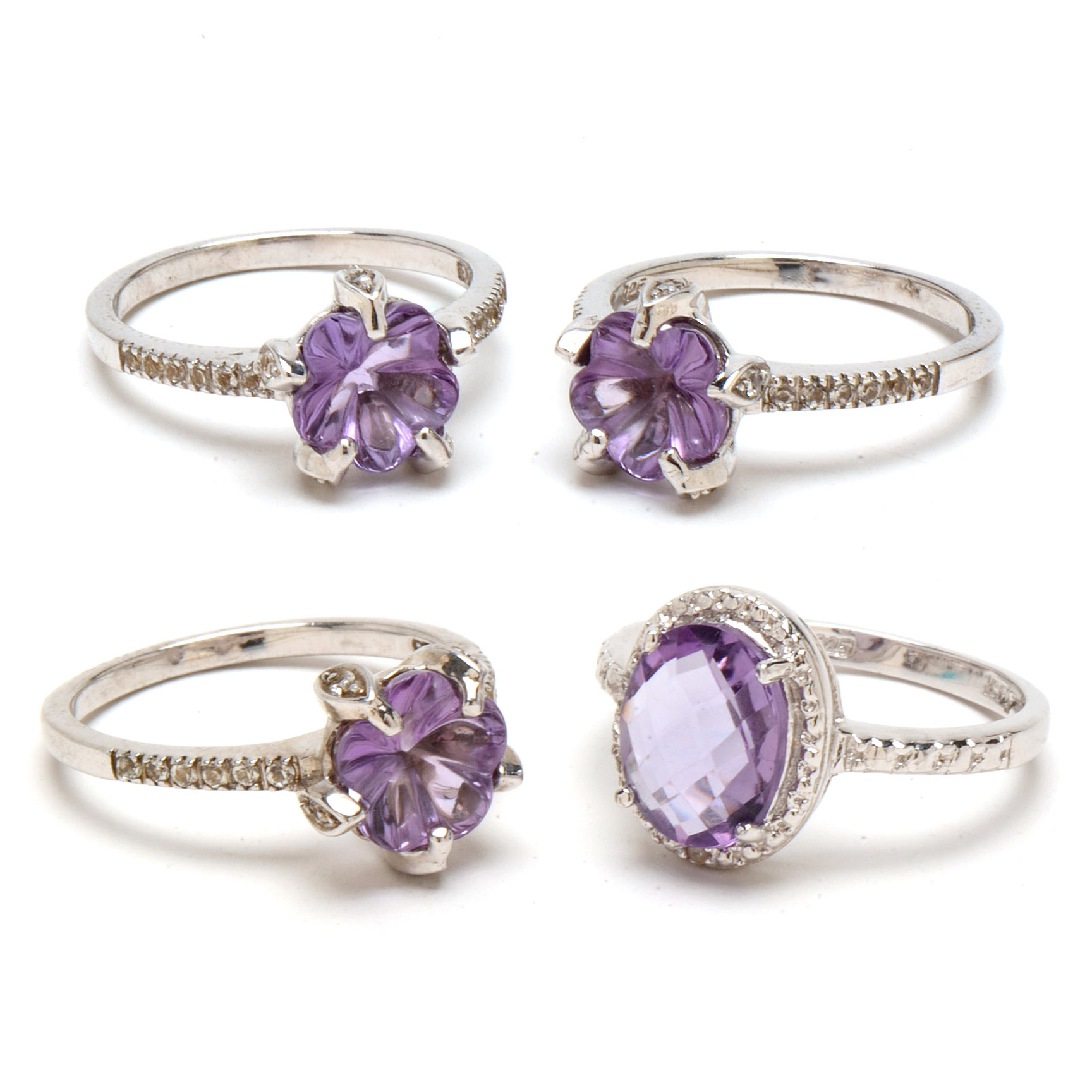 Four Sterling Amethyst Rings with Diamond and Topaz Accents