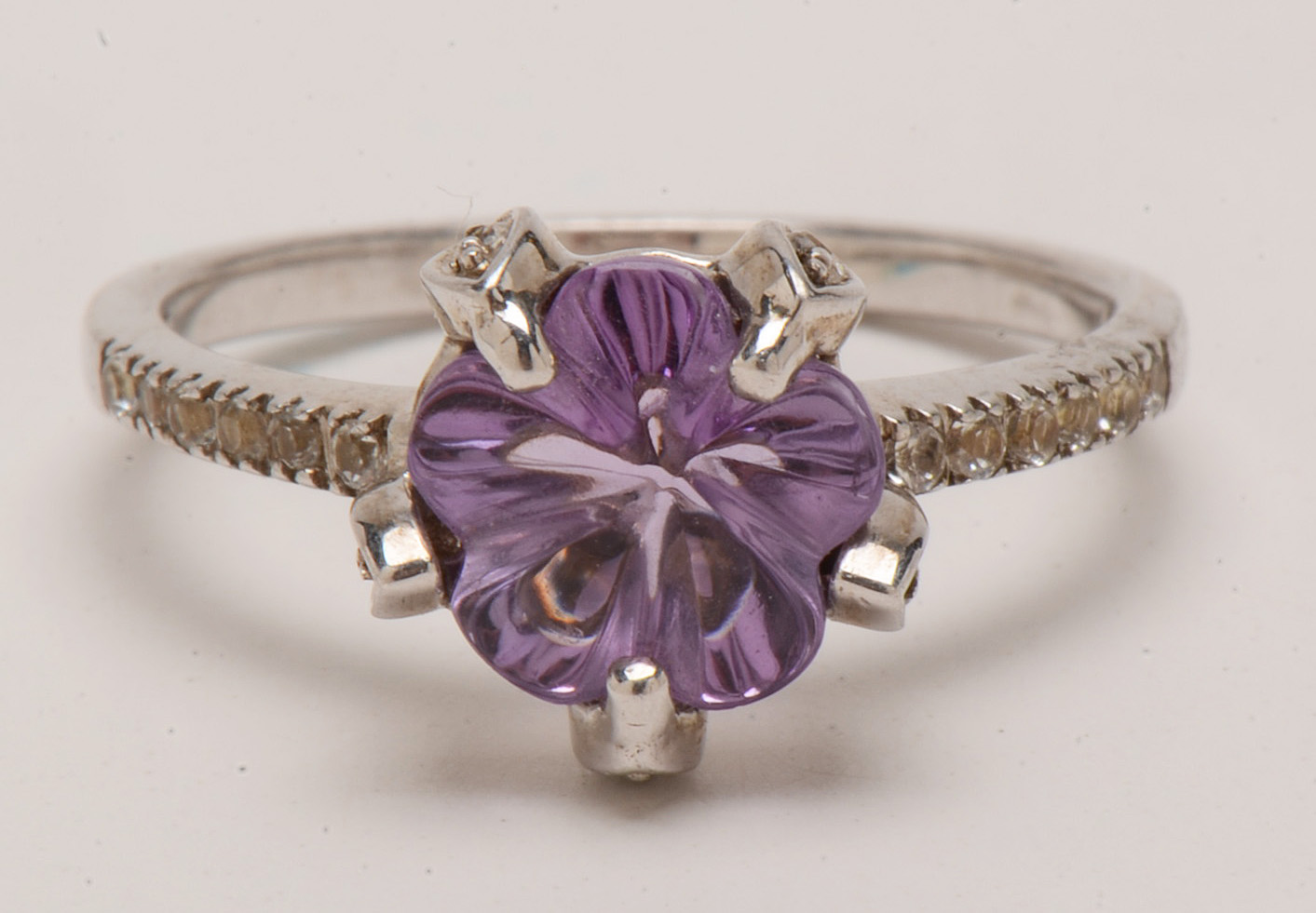 Four Sterling Amethyst Rings with Diamond and Topaz Accents