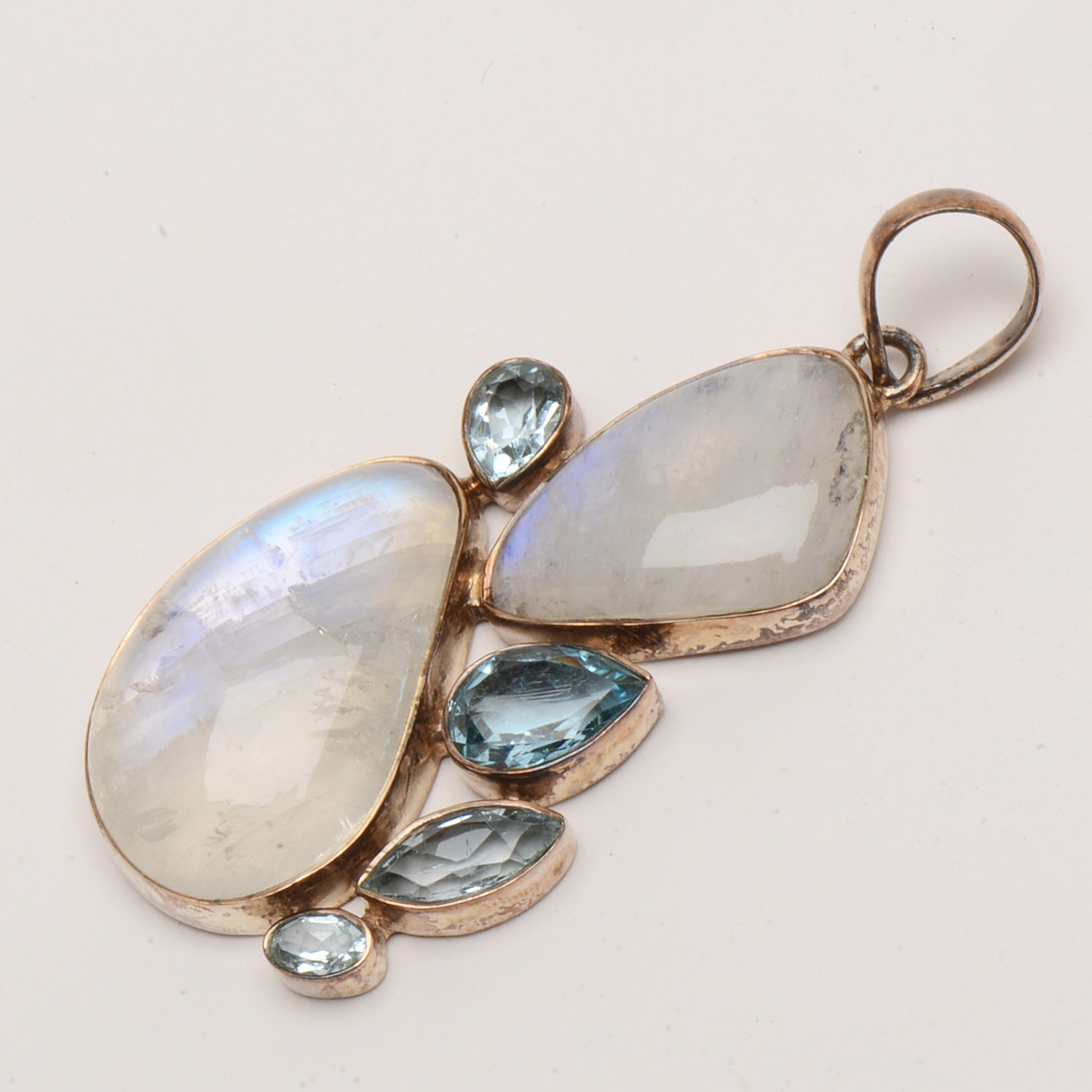 Two Sterling Rainbow Moonstone and Topaz Pendants