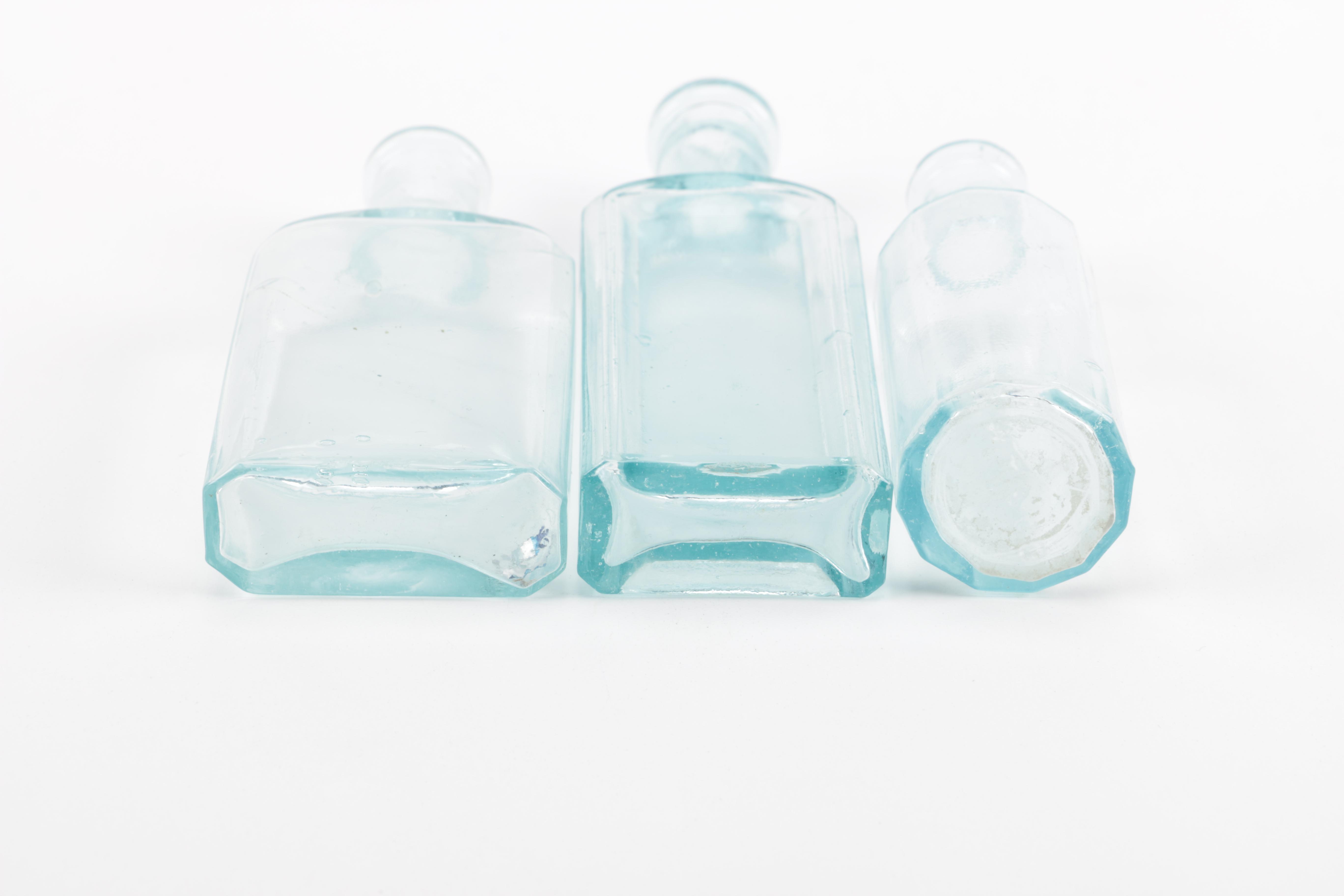 Glass Vase and Bottles Featuring Whitall & Tatum Co.