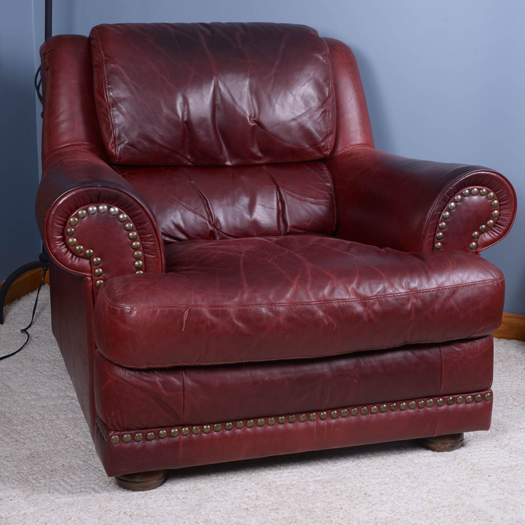 Natuzzi Burgundy Leather Armchair and Ottoman