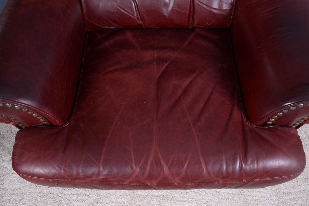 Natuzzi Burgundy Leather Armchair and Ottoman