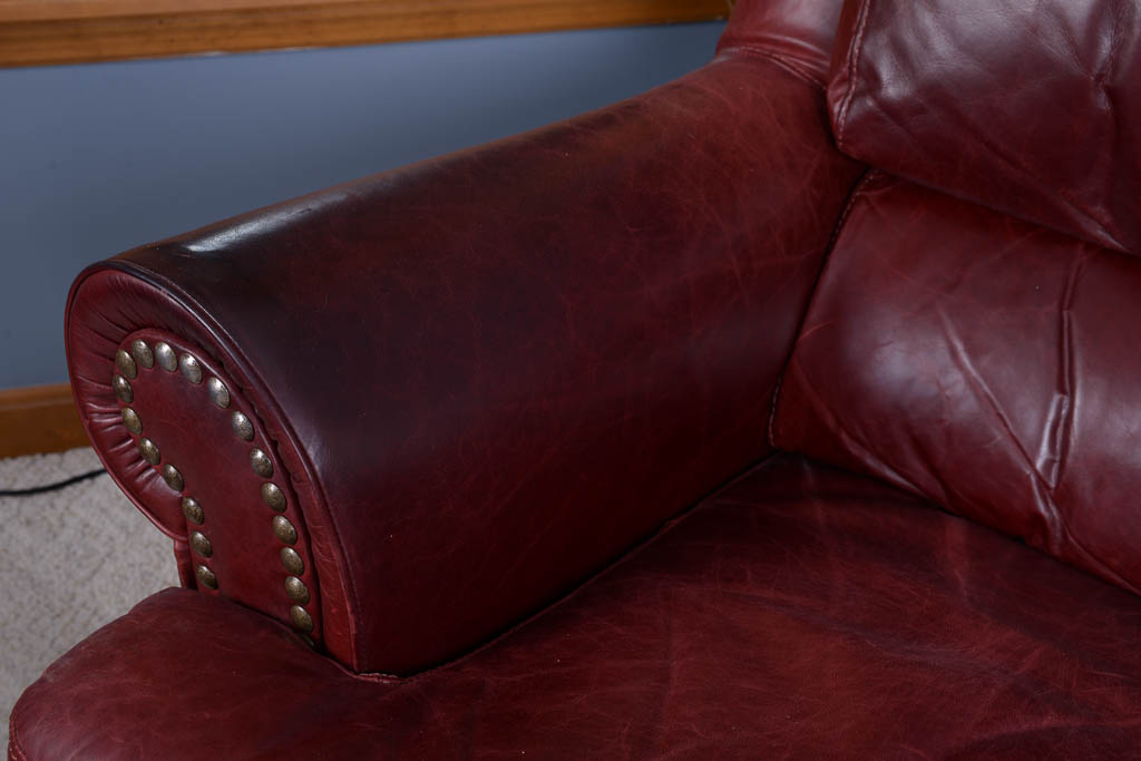 Natuzzi Burgundy Leather Armchair and Ottoman