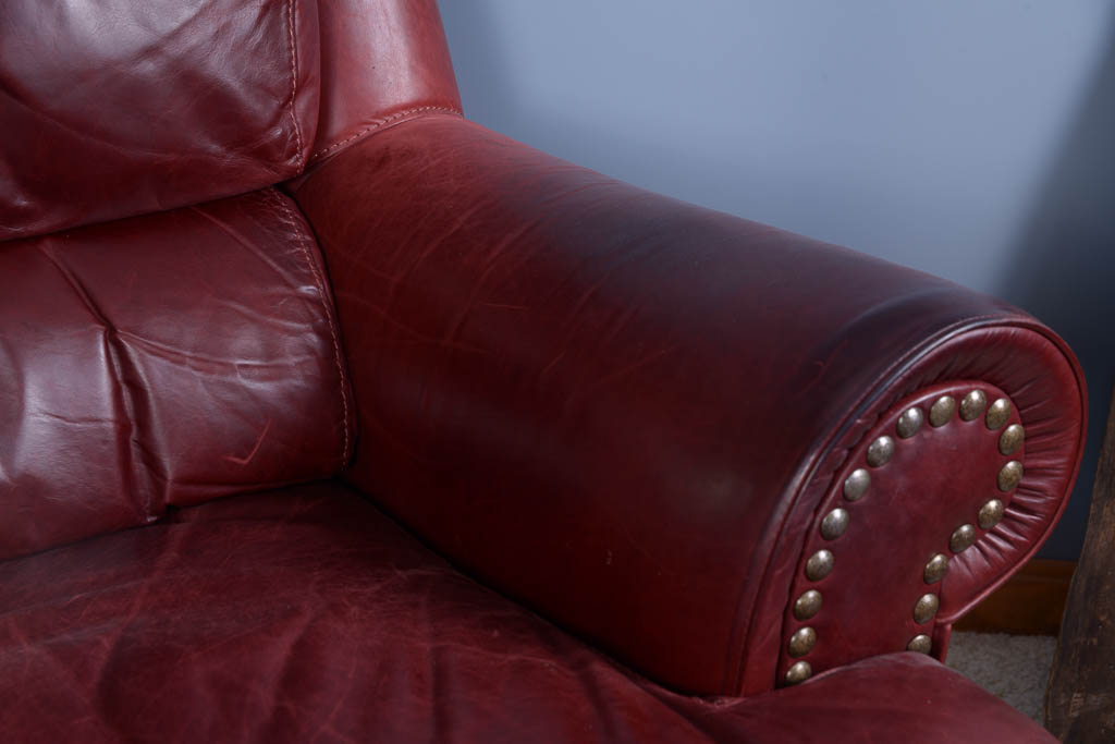 Natuzzi Burgundy Leather Armchair and Ottoman