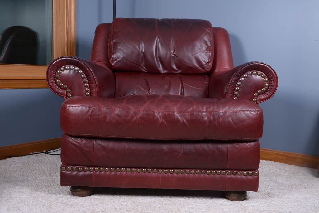 Natuzzi Burgundy Leather Armchair and Ottoman