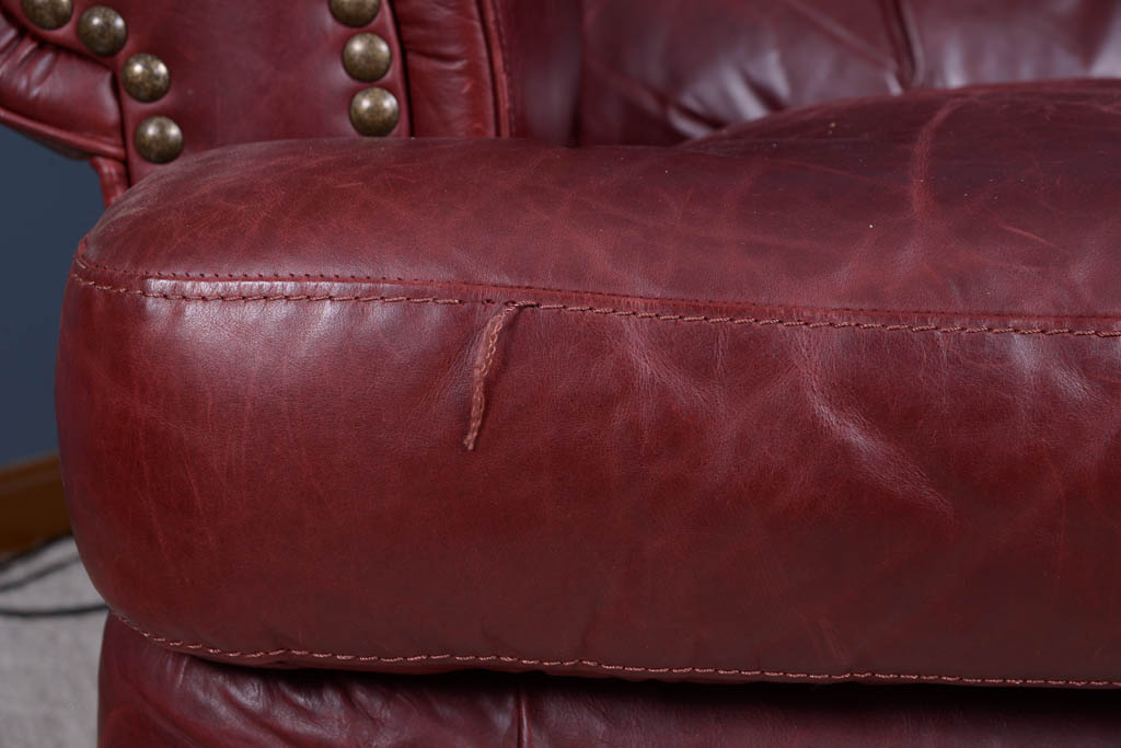 Natuzzi Burgundy Leather Armchair and Ottoman