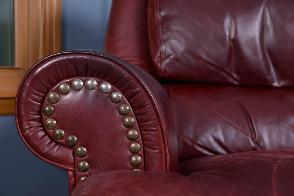 Natuzzi Burgundy Leather Armchair and Ottoman