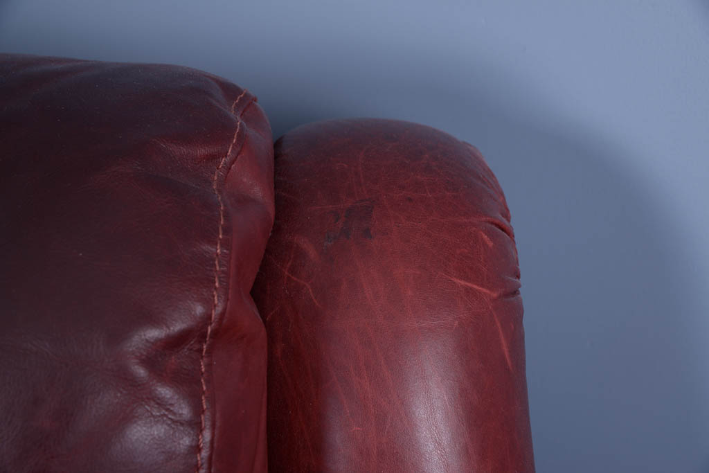 Natuzzi Burgundy Leather Armchair and Ottoman