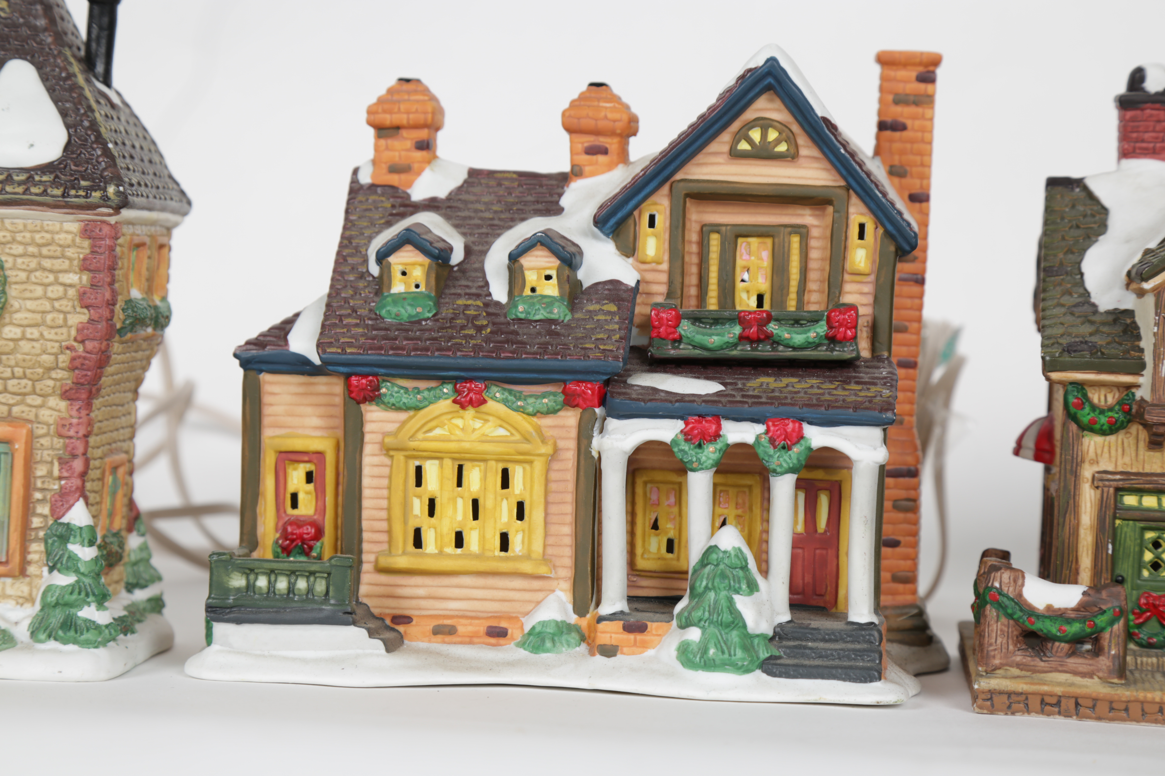 Collection of "Santa's Workbench Collection" Illuminated Houses
