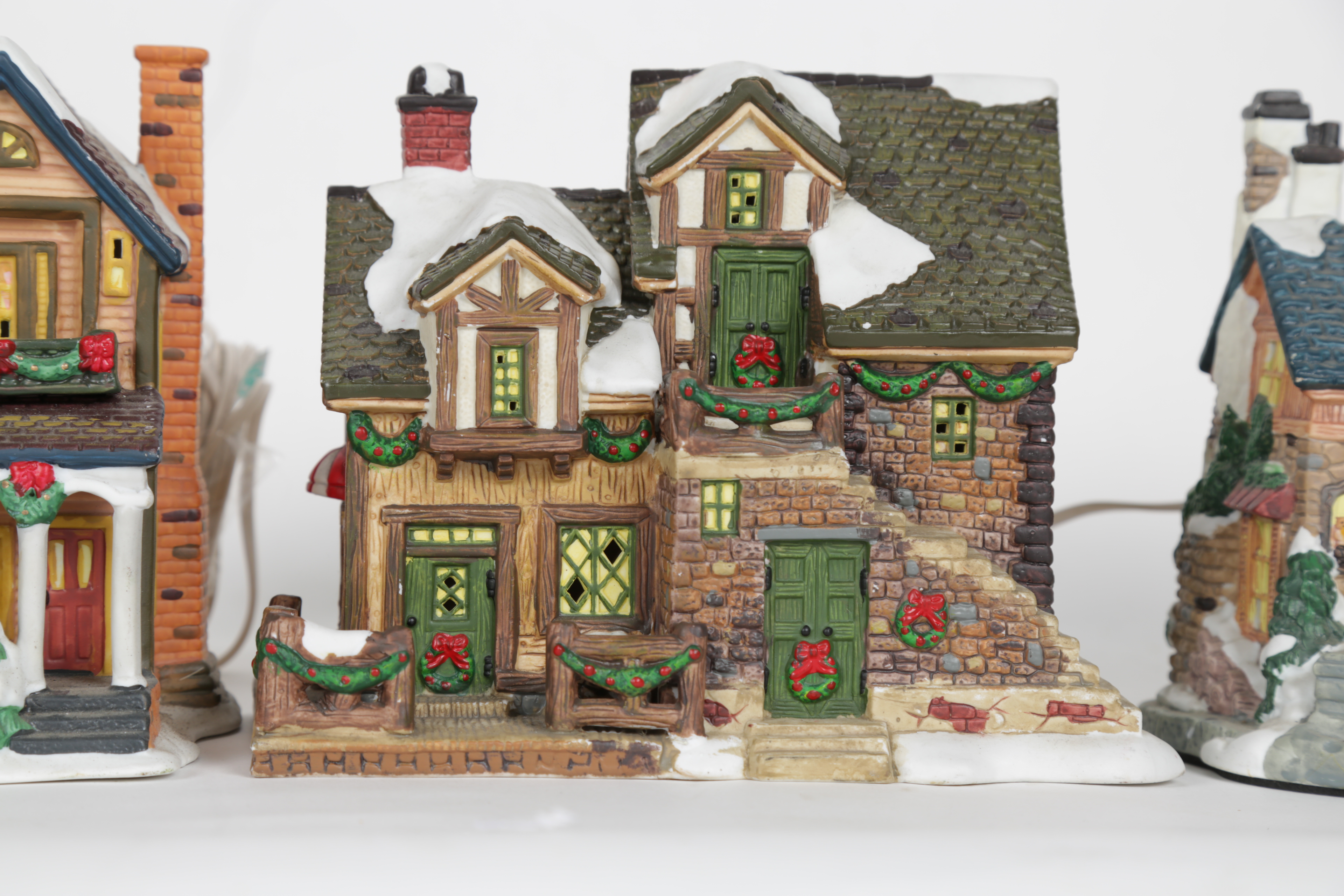 Collection of "Santa's Workbench Collection" Illuminated Houses