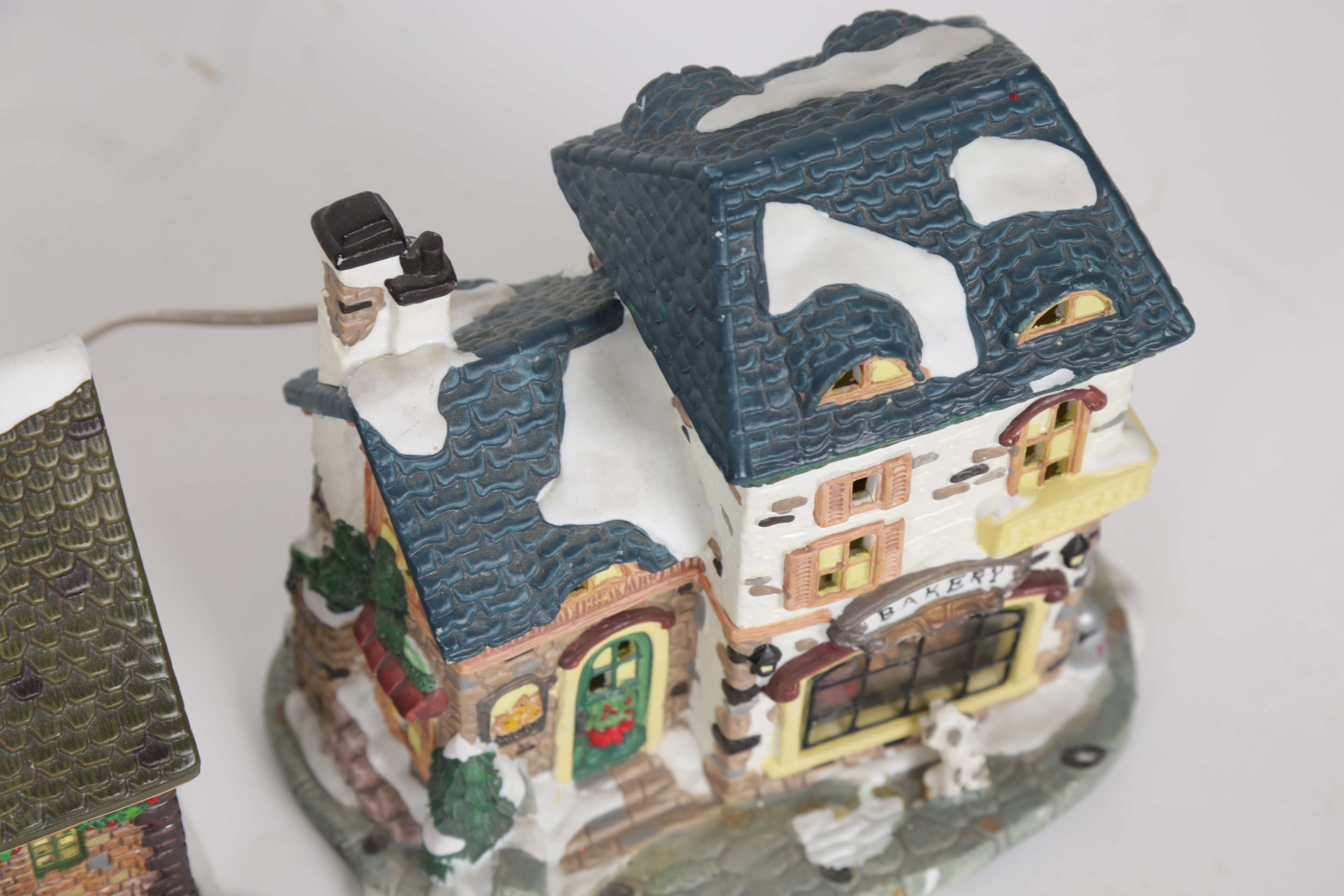 Collection of "Santa's Workbench Collection" Illuminated Houses