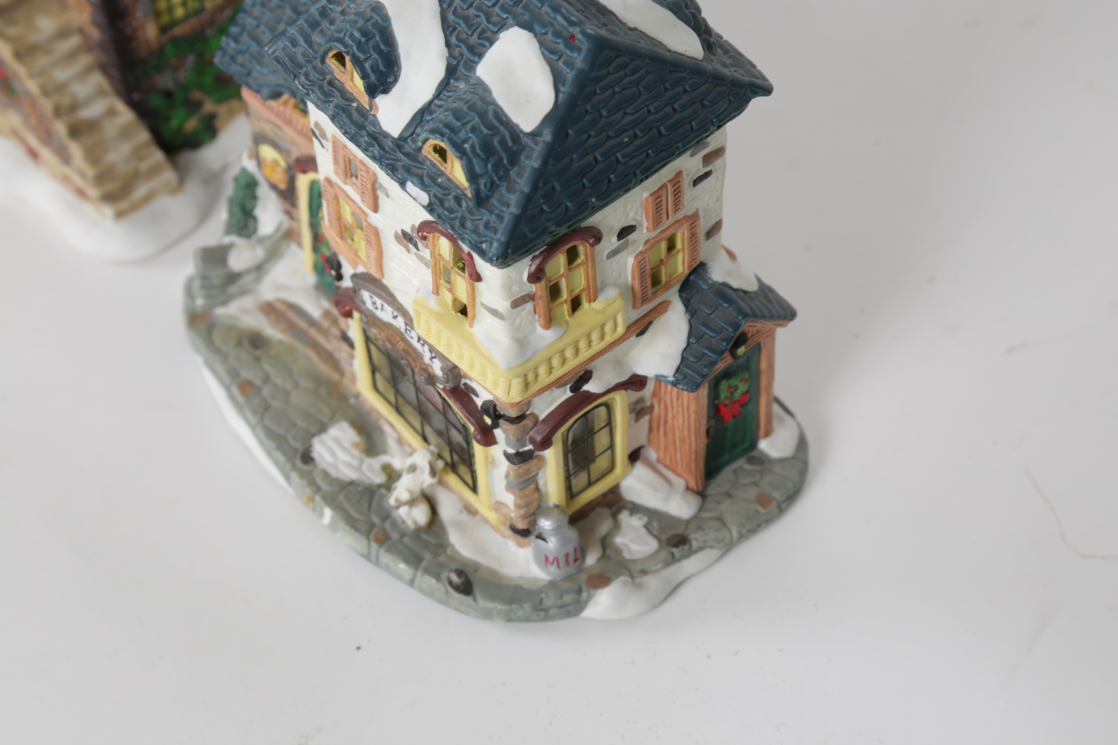 Collection of "Santa's Workbench Collection" Illuminated Houses