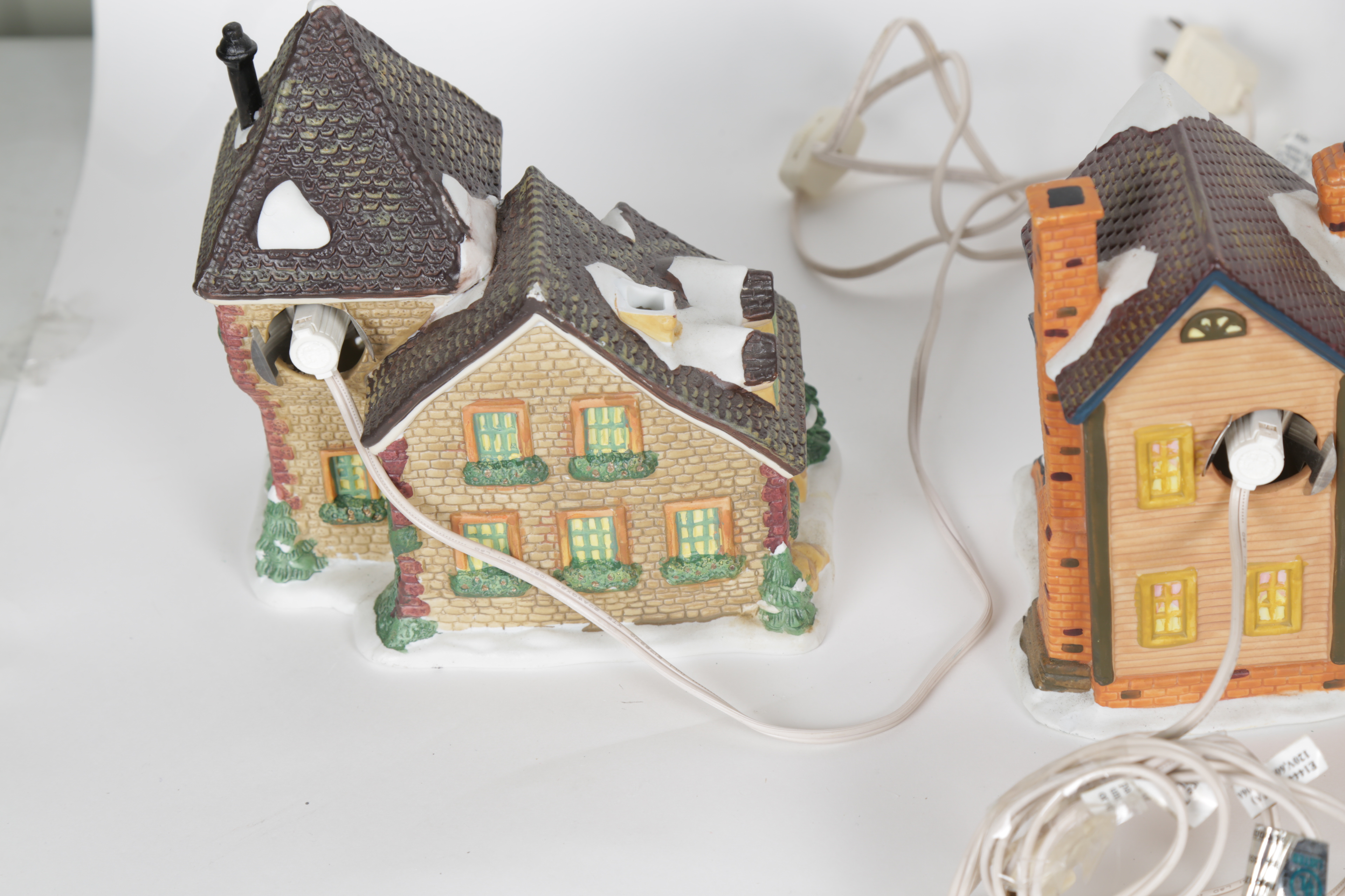 Collection of "Santa's Workbench Collection" Illuminated Houses