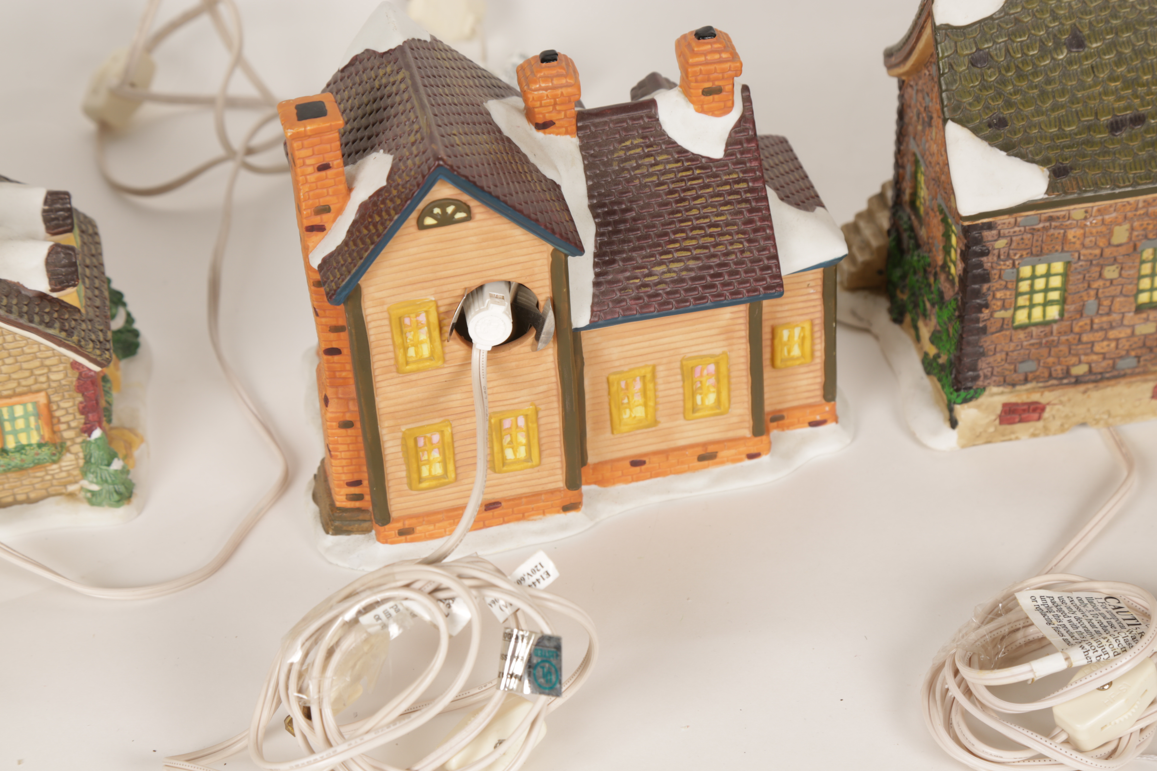 Collection of "Santa's Workbench Collection" Illuminated Houses