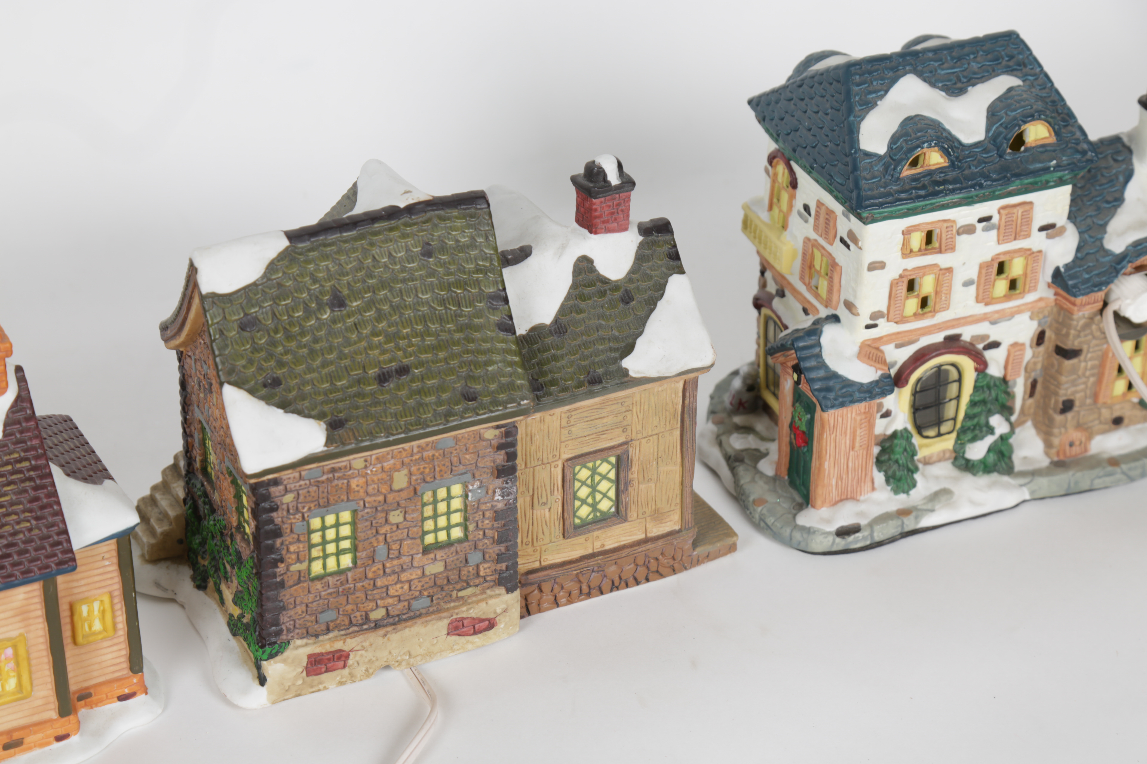 Collection of "Santa's Workbench Collection" Illuminated Houses