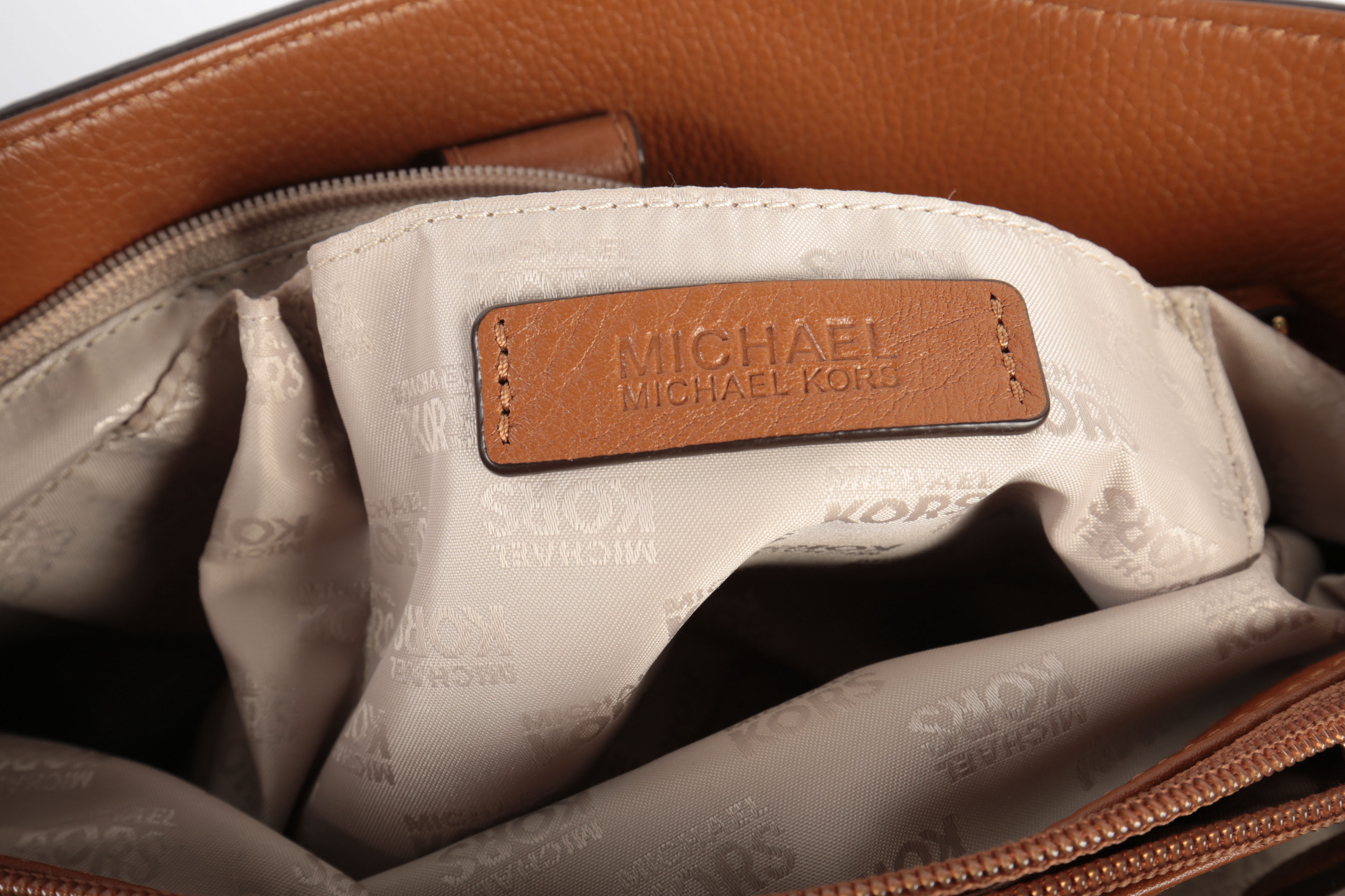 Three Michael Kors Handbags