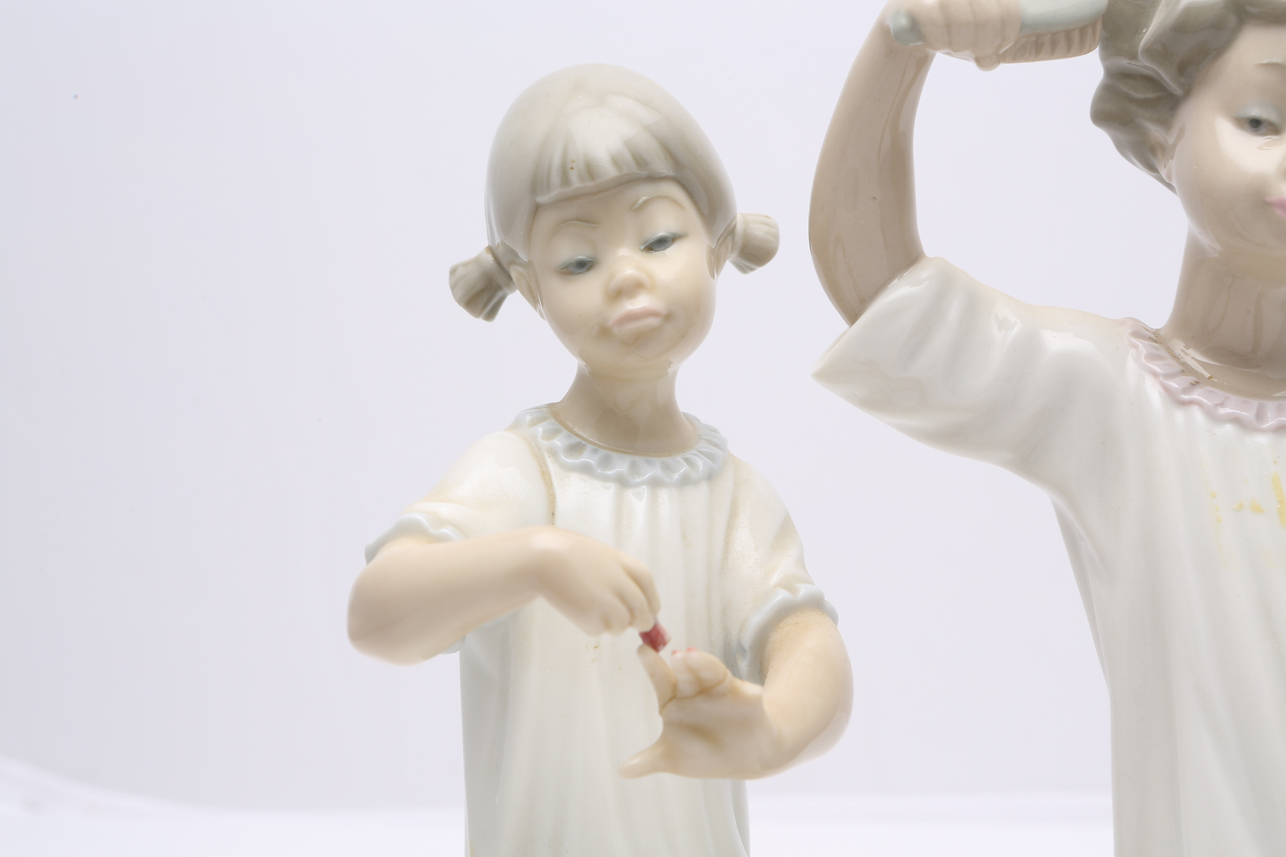 Lladró "Girl with Brush" #1081 and "Girl Manicuring" #1082