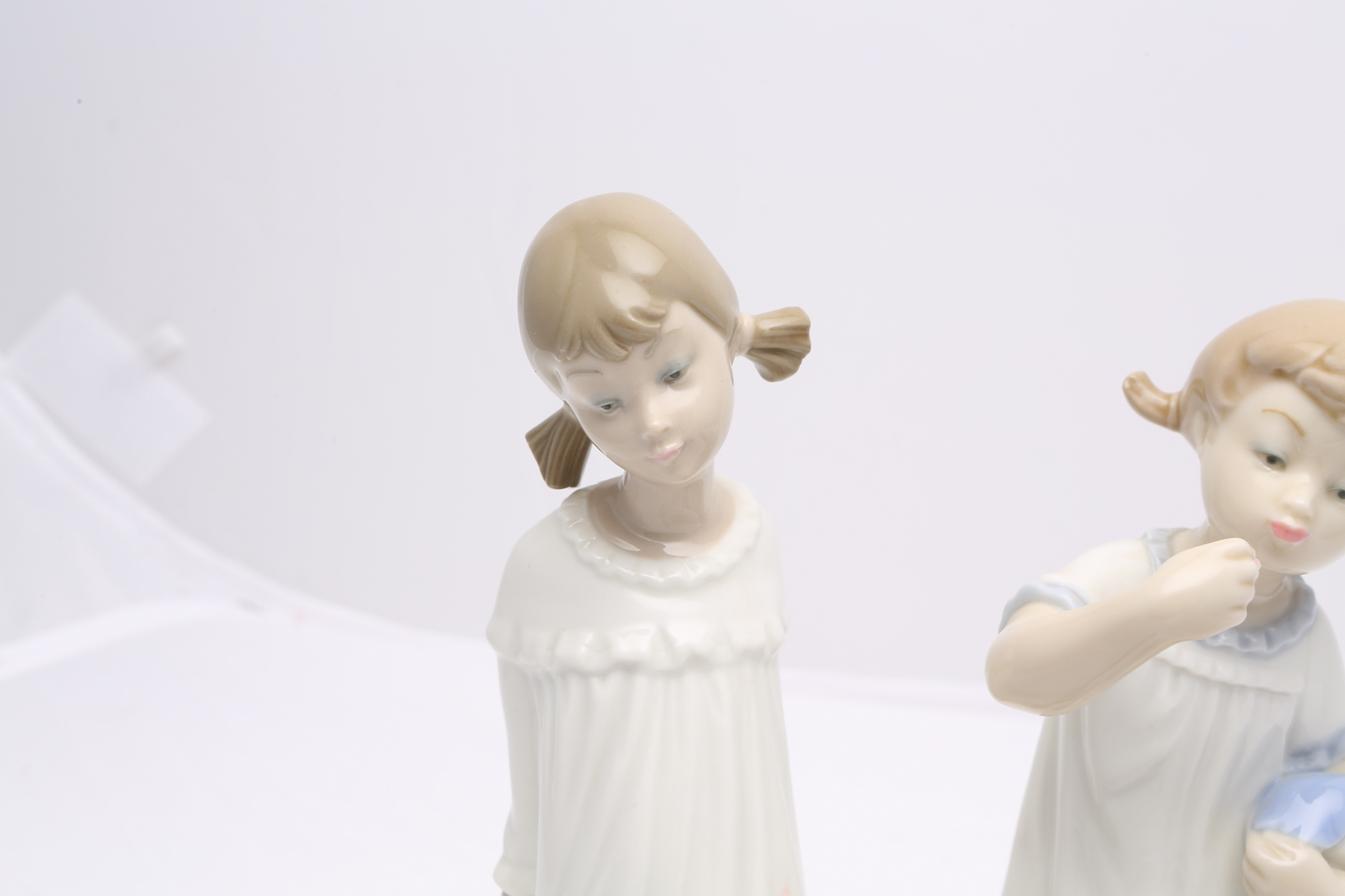 Lladró "Girl with Doll" #1083 and "Girl With Mother's Shoe" #1084