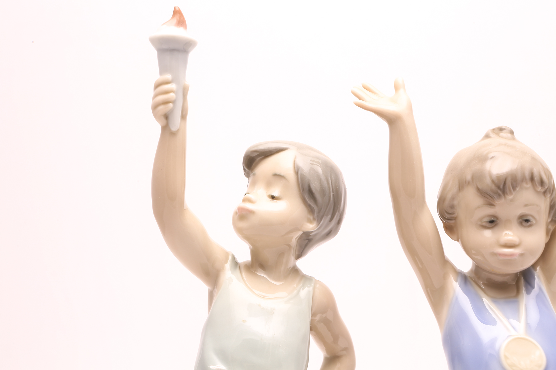 Lladró "Olympic Torch" #5870 and "Olympic Champion" #5871