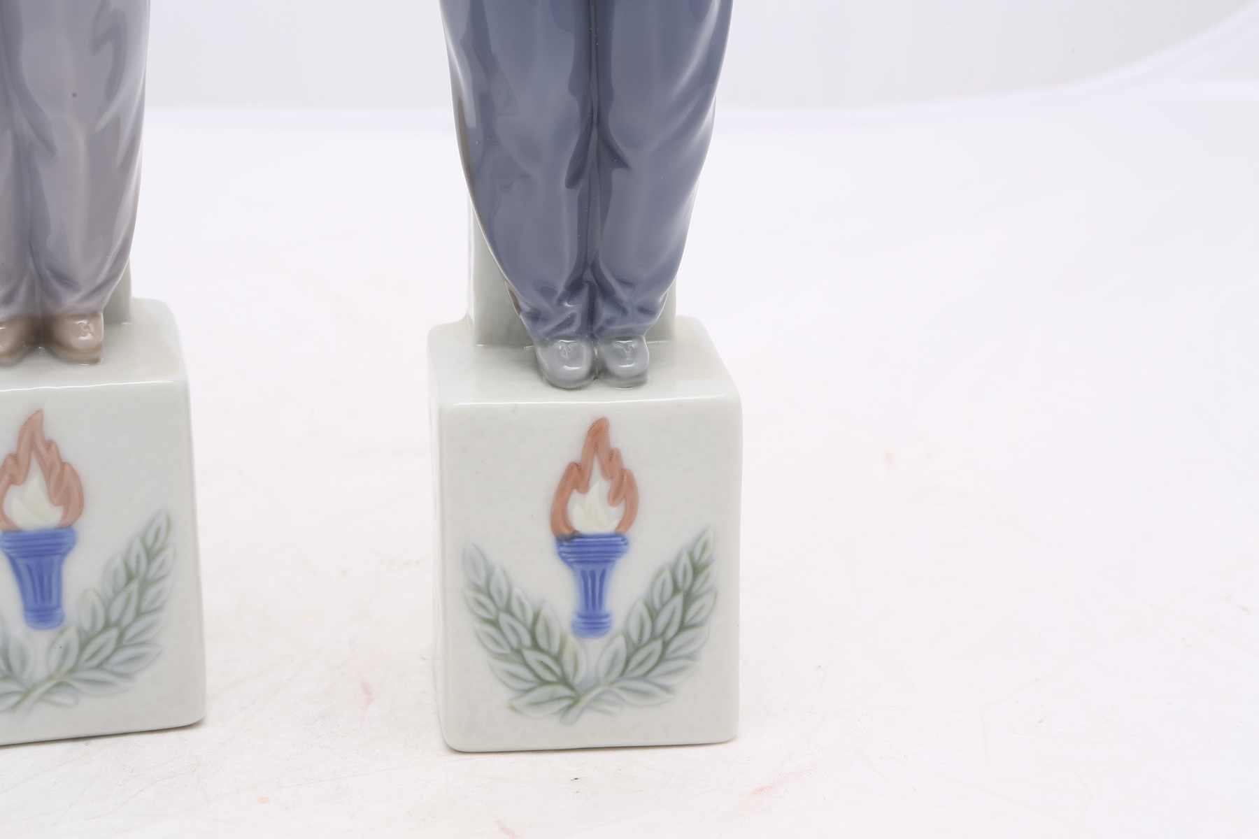 Lladró "Olympic Torch" #5870 and "Olympic Champion" #5871