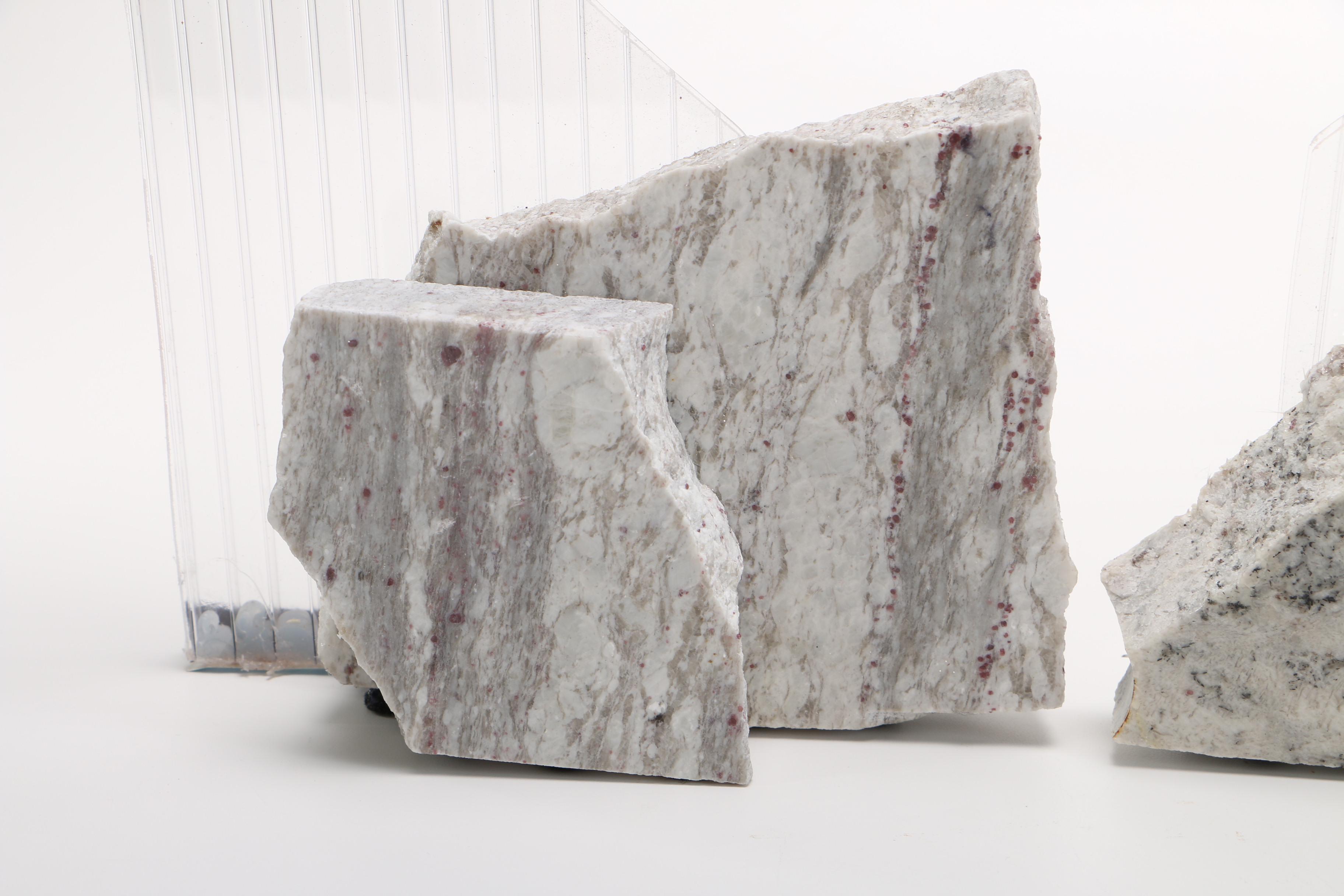 Corrugated Acrylic Shard and Gray Granite Sculptures