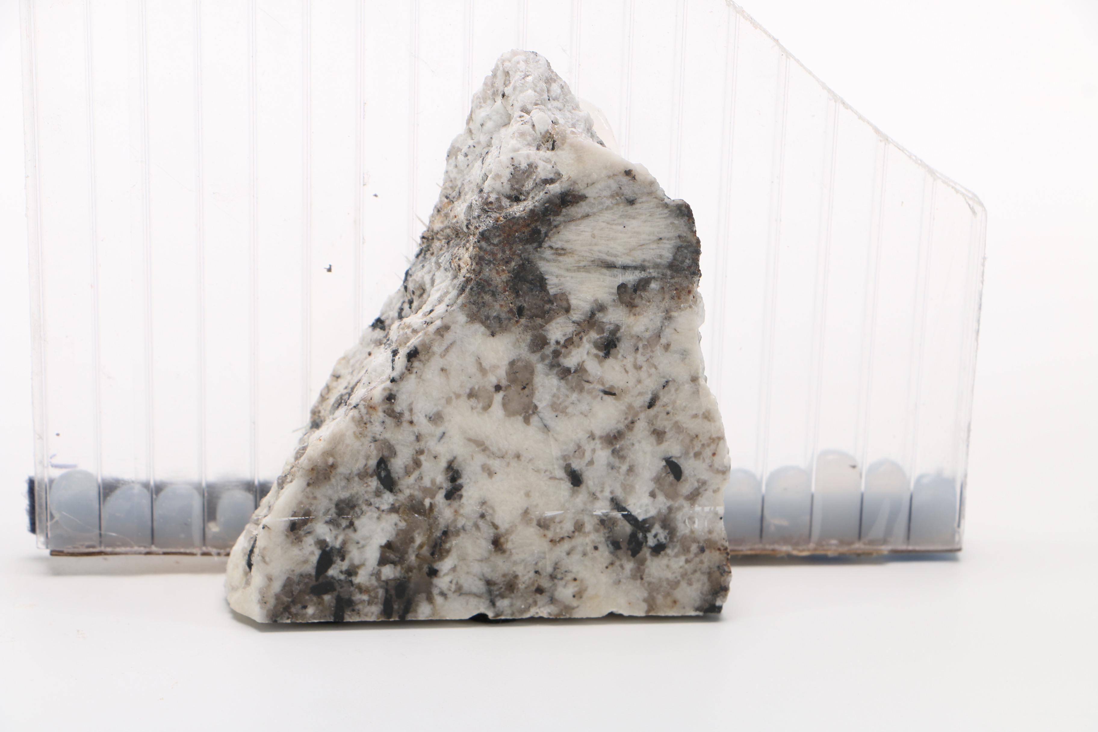 Corrugated Acrylic Shard and Gray Granite Sculptures