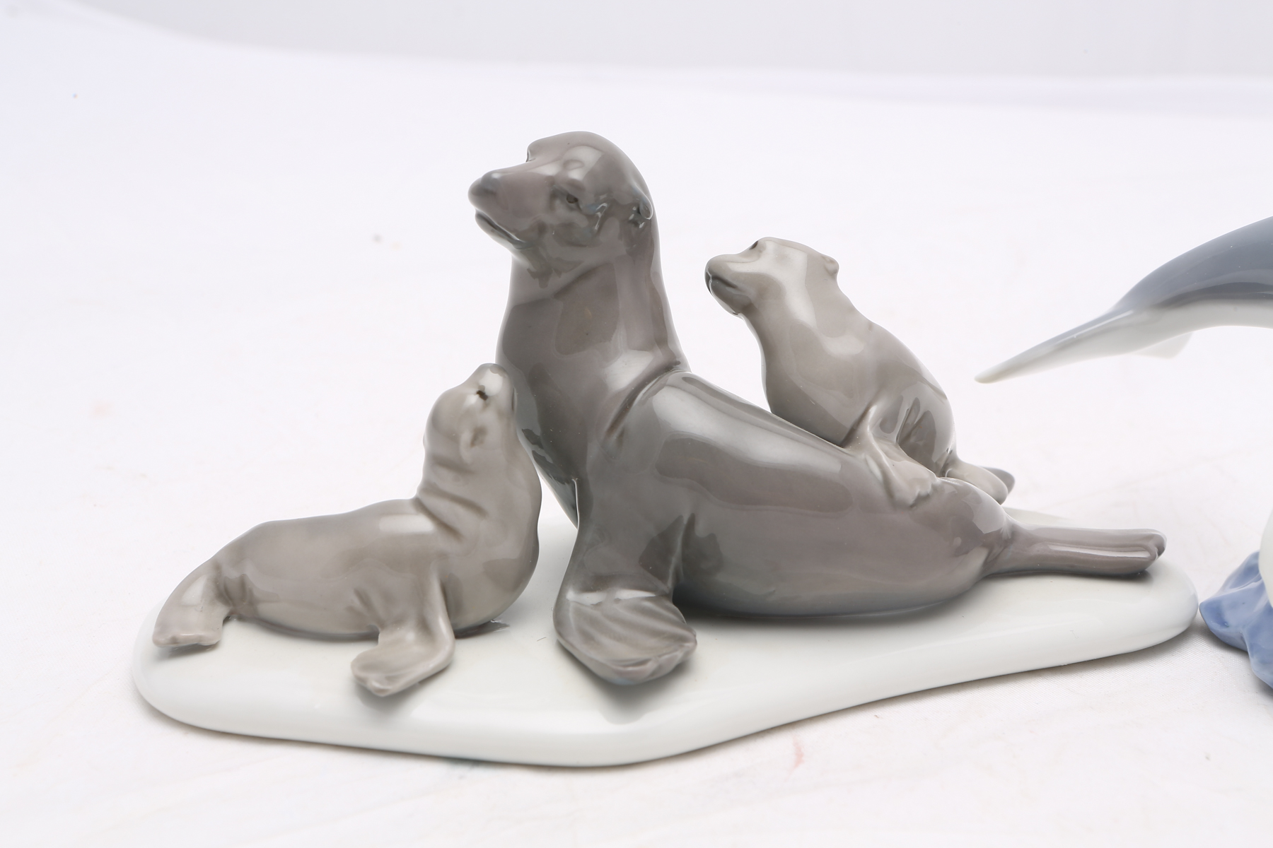 Lladró "Mini Seal Family" #5318 and "Lucky Dolphin" #8104