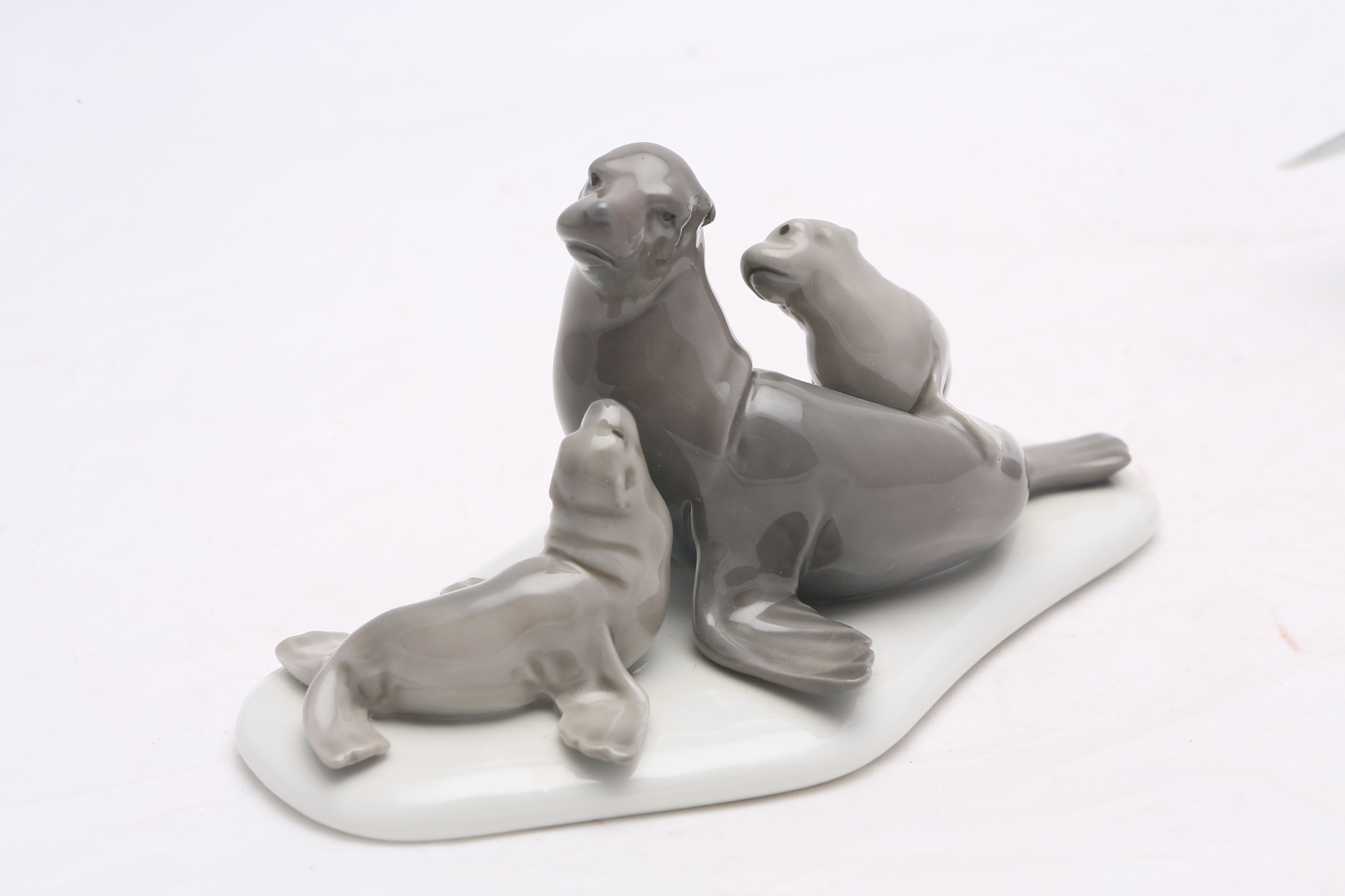 Lladró "Mini Seal Family" #5318 and "Lucky Dolphin" #8104